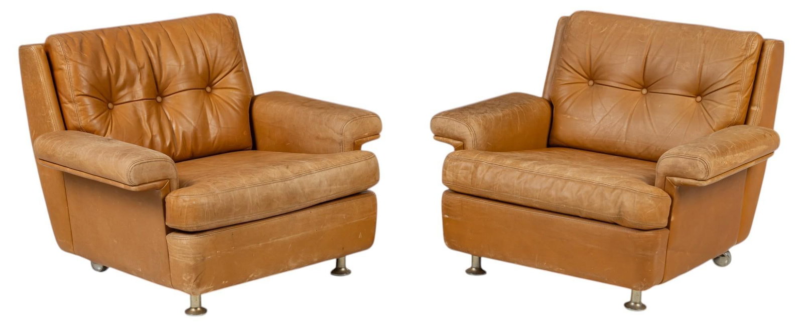 Pair of Danish Mid-Century Lounge Chairs: Pair of Danish mid-century lounge chairs featuring orange brown leather upholstery, and tufted back cushion, supported on metal legs height 28 in. x width 36 in. x depth 32 in. Condition: wear to leat