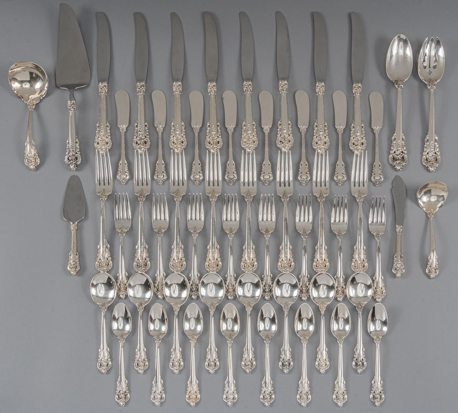 "Grande Baroque" By Wallace Silversmiths Sterling Silver Flatware set: "Grand Baroque" by Reed and Barton Silversmiths sterling silver flatware set of 55 pc, service for 8, no monogram or removal Includes: 8 dinner knives 9 1/8 in. 8 dinner forks 7 7/8 in. 8 lun
