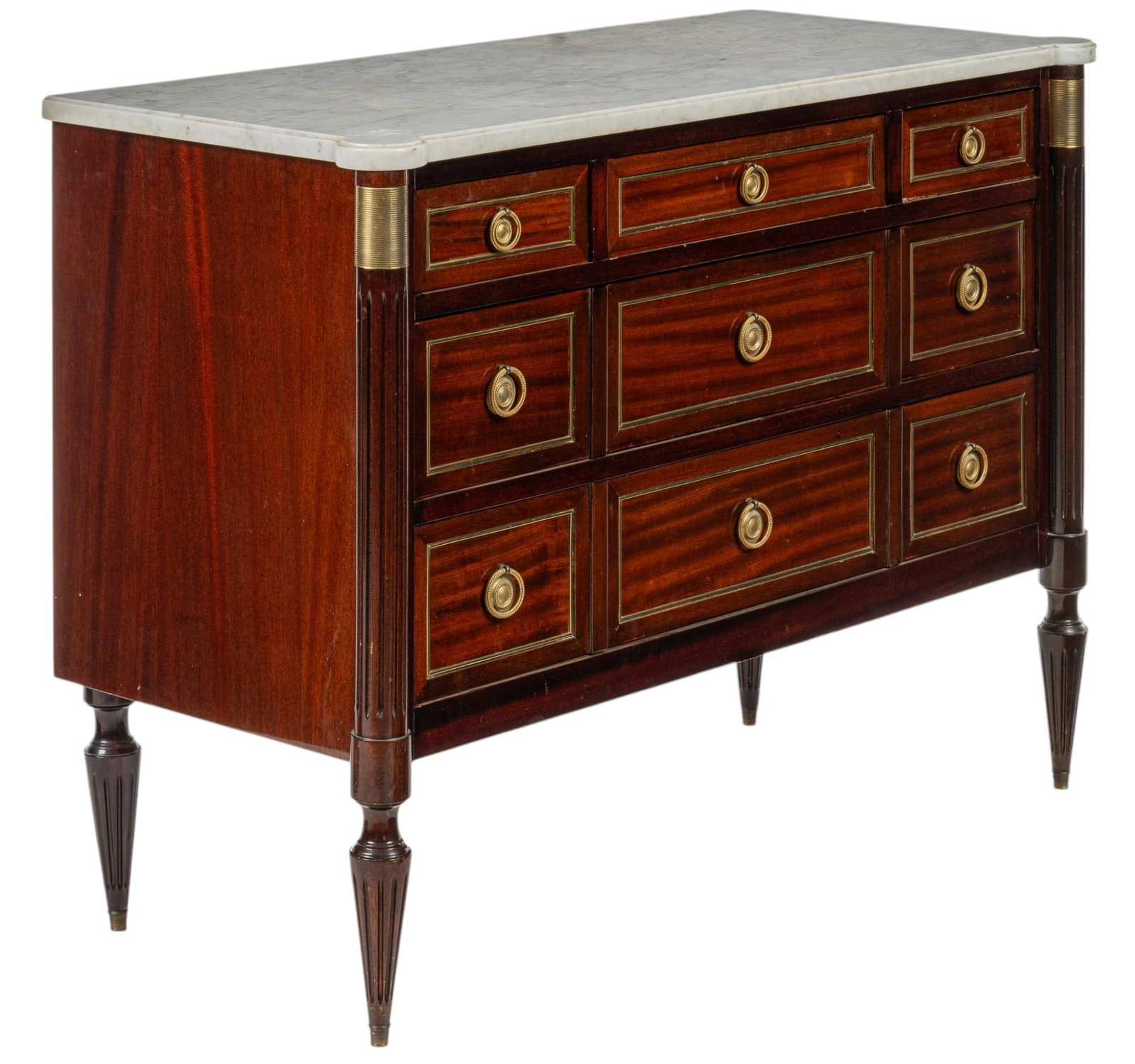 Marble Top Louis XVI Dresser: Louis XVI dresser with white marble top, and nine drawers with metal ring pulls, and ormolu along drawer paneling, supported on tapered turned legs with fluted details height 33 in. x width 36 in. x d