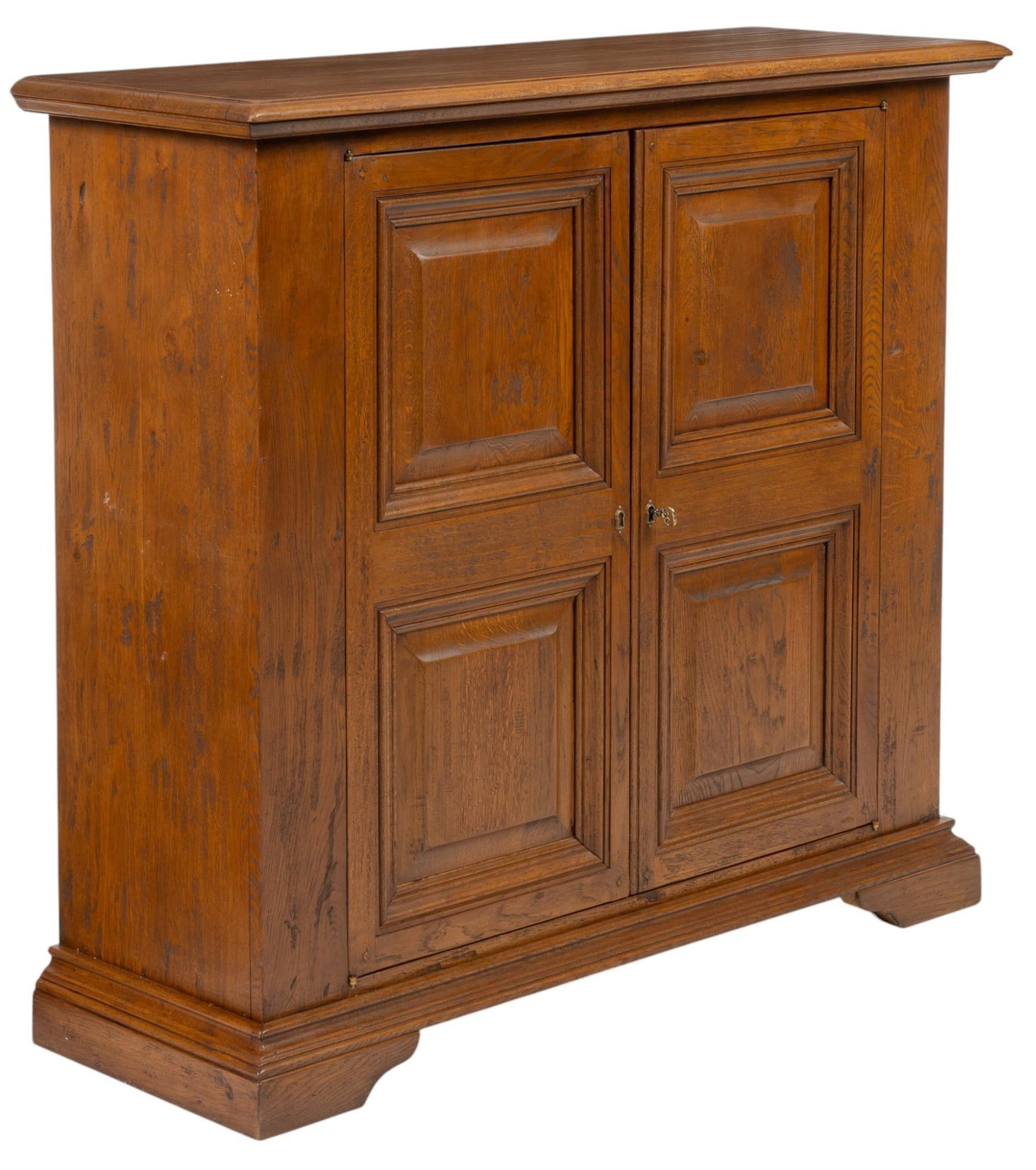 Louis Philippe Period Sideboard: Louis Philippe period sideboard featuring oversize top above pair of paneled doors that open to interior storage with two shelves, supported on plinth, circa 1860 height 47 in. x width 52 in. x depth 