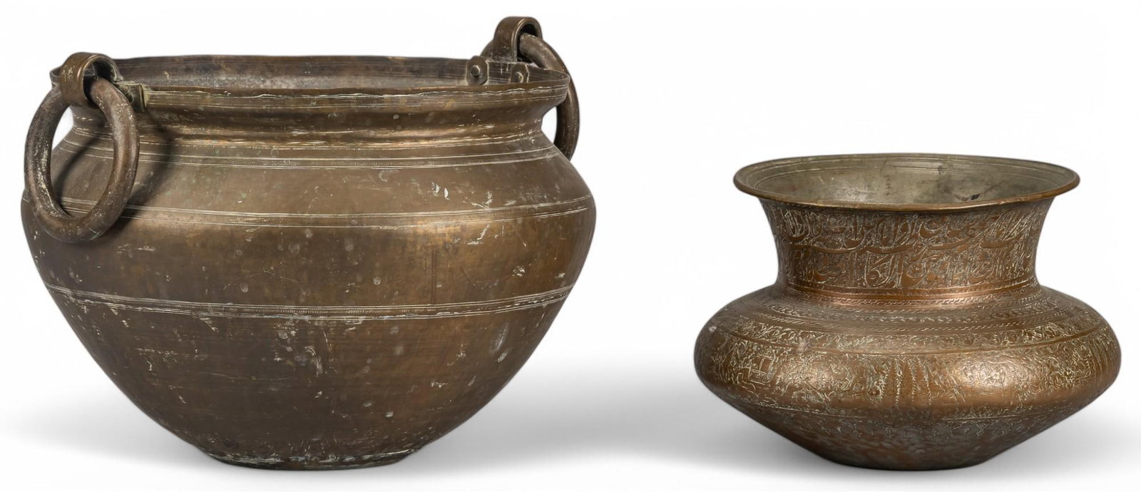 Pair of Brass Vessels: Pair of brass vessels height 10 in. x width 16 in. x depth 15.5 in. Provenance: The Estate of Sylvia Flores, from her landmark mid-century home in the Olmos Park neighborhood of San Antonio, Texas