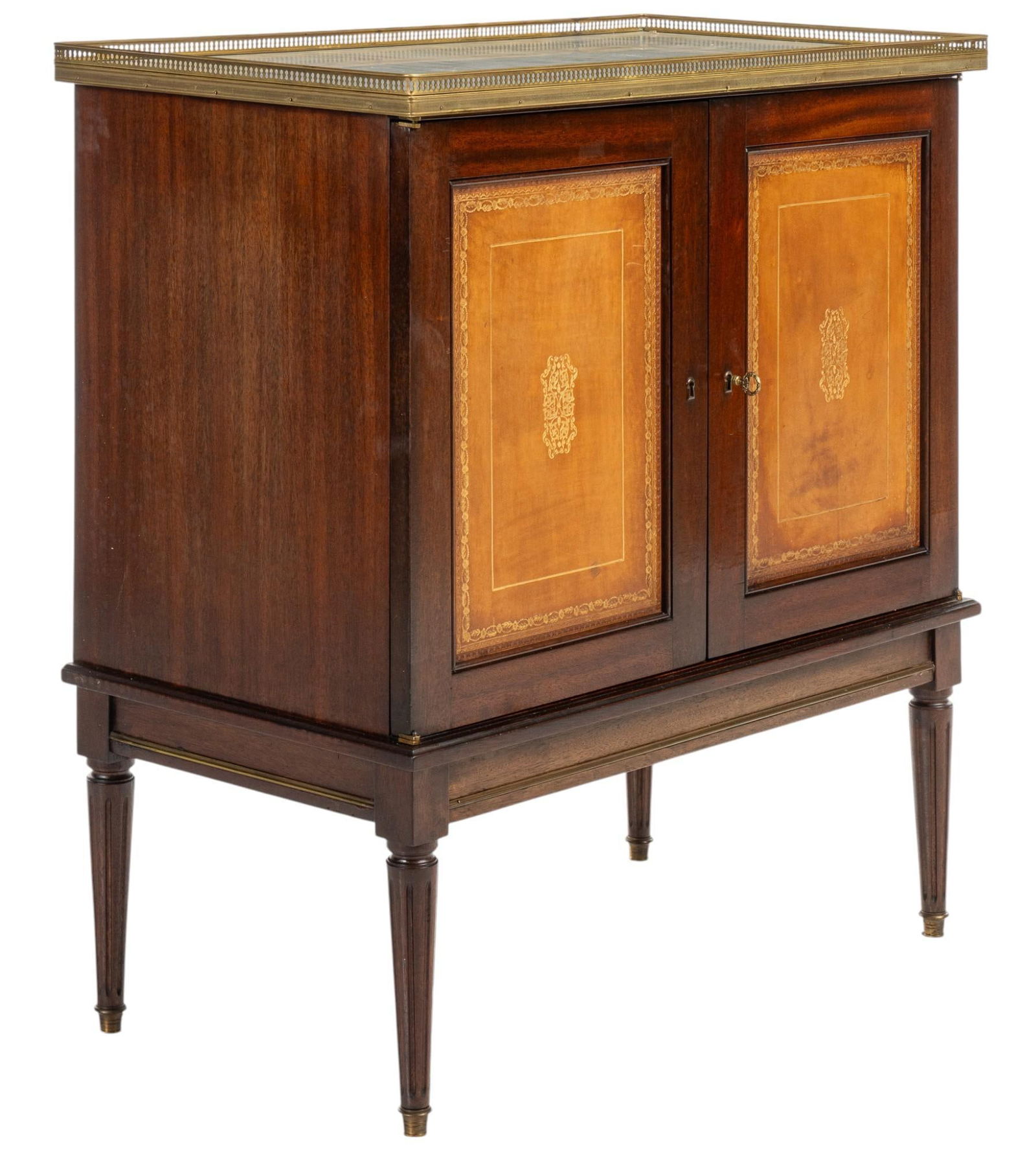 Louis XVI Style Cabinet: Louis XVI style cabinet, having marble top with gilt brass gallery rails, over cabinet doors with leather inlay and floral motif, doors hinge open to reveal interior storage, supported on wooden pin l