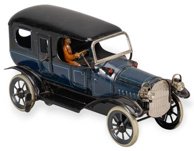 Attrib. Karl Bub Tin Wind-Up Car: Antique lithographed tin wind-up limousine toy car, circa early 1900s, attributed to Karl Bub height 4.5 in. x width 4 in. x depth 9 in. Provenance: The Estate of Sylvia Flores, from her landmark mi
