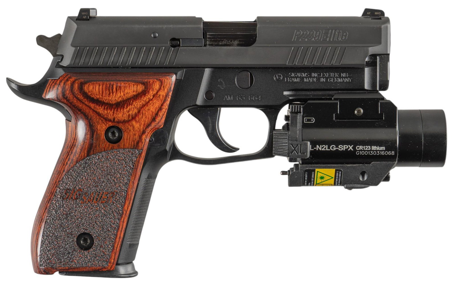 Sig Sauer P229 Elite 40S&W Semi-Auto Pistol: Serial: AM63664 Manufacturer: Sig Sauer-Germany/SIGARMS INC.-Exeter, NH Model: P229 Elite Caliber: 40S&W Barrel length: 3.75 in. OAL: 7.5 in. (9 in. with laser/light module) Condition: Good; grips