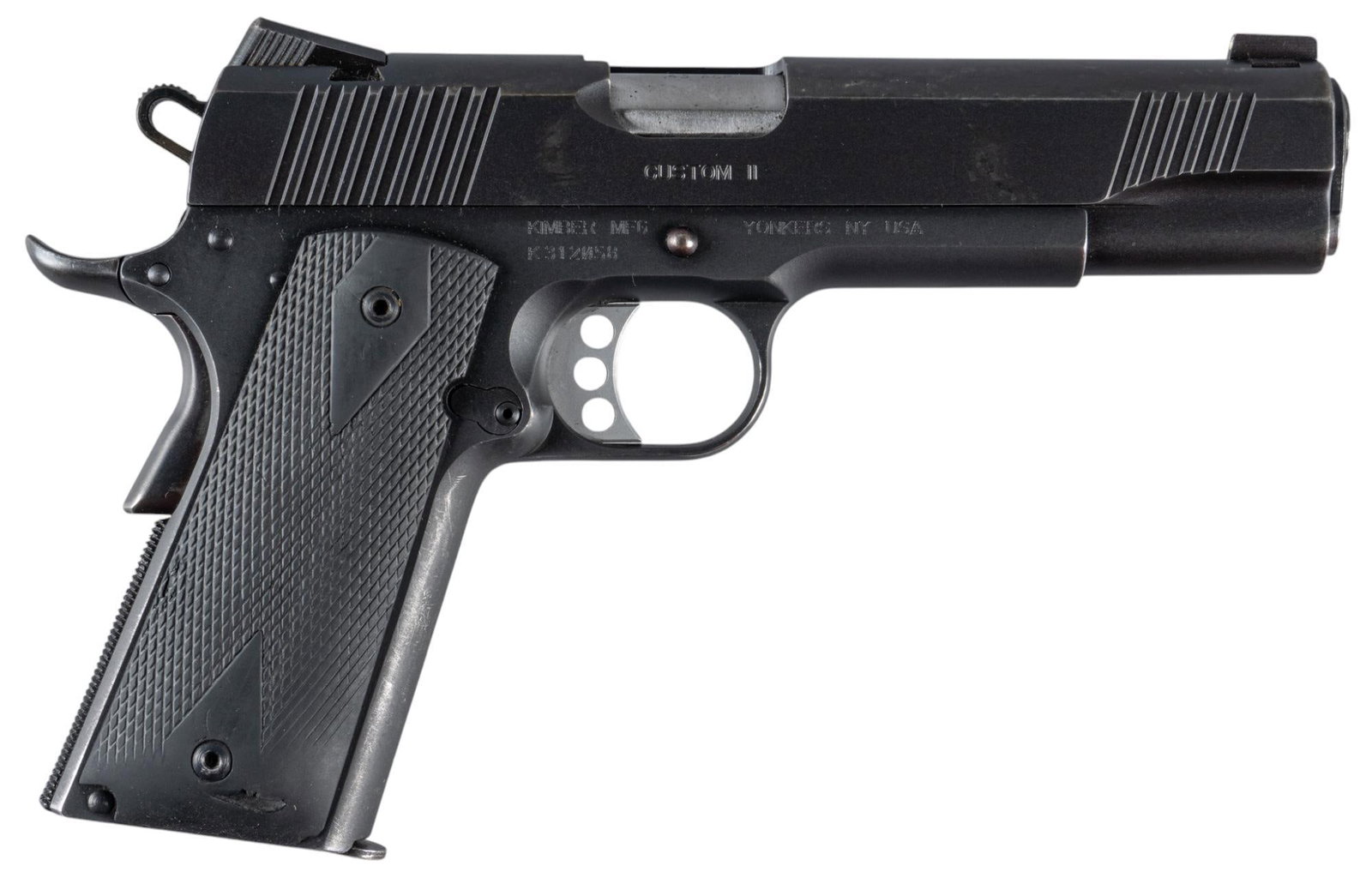 Kimber Custom II 45 ACP Semi-Auto Pistol: Serial: K312058 Manufacturer: Kimber Model: Custom II Caliber: 45 ACP Barrel length: 5 in. OAL: 9 in. Condition: Good; plastic grips have light-moderate wear & handling marks including a small tea