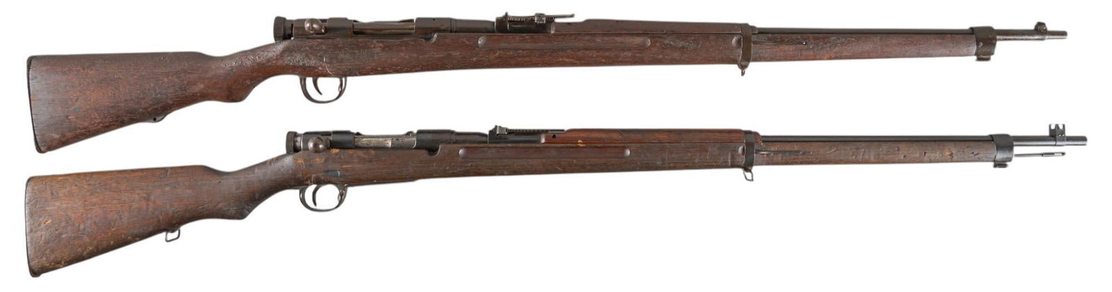 Pair of WWII Japanese Type 38 6.5x50SR Bolt Action Rifles: Serial: (1) 55574; (2) NSN Manufacturer: (1) Tokyo Arsenal-Japan; (2) Nagoya Arsenal-Japan Model: Type 38 Caliber: 6.5x50SR Barrel length: (1) 31 in.; (2) 30 in. OAL: (1) 50.5 in.; (2) 49 in. Conditio