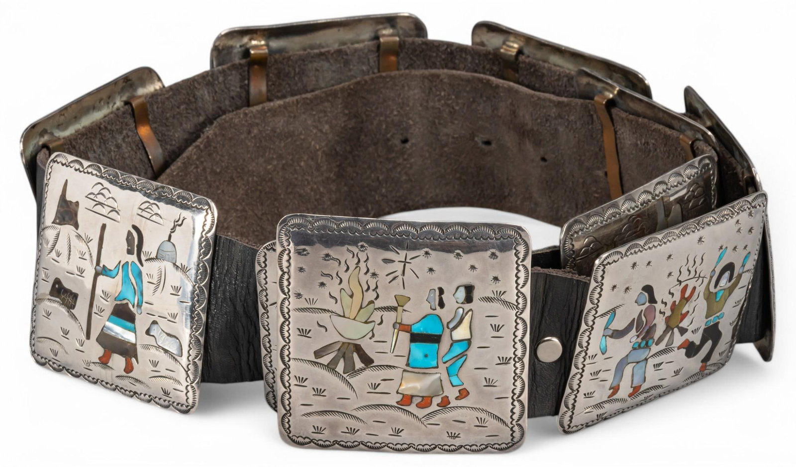 Sterling Silver Inlaid Navajo Storyteller Concho Belt: Sterling silver inlaid Navajo storyteller concho belt featuring ten inlaid stone conchos, marked " Raymond B. Navajo" Length: 42 in. Total weight: 21.70 ozt Provenance: Property from an Alamo 
