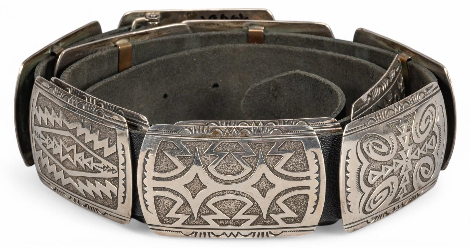 Sterling Silver Navajo Overlay Style Concho Belt: Sterling silver Navajo overlay style concho belt featuring eleven rectangular conchos with geometric overlay details, unmarked Length: 49 in. Total weight: 14.05 ozt Provenance: Property from the coll