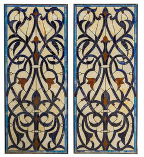 Pair of Slag Glass Windows: Pair of slag glass windows with polychrome pieces, and scroll motifs height 52 in. x width 22 in. each Provenance: Property from the collection of a San Antonio, Texas gentleman