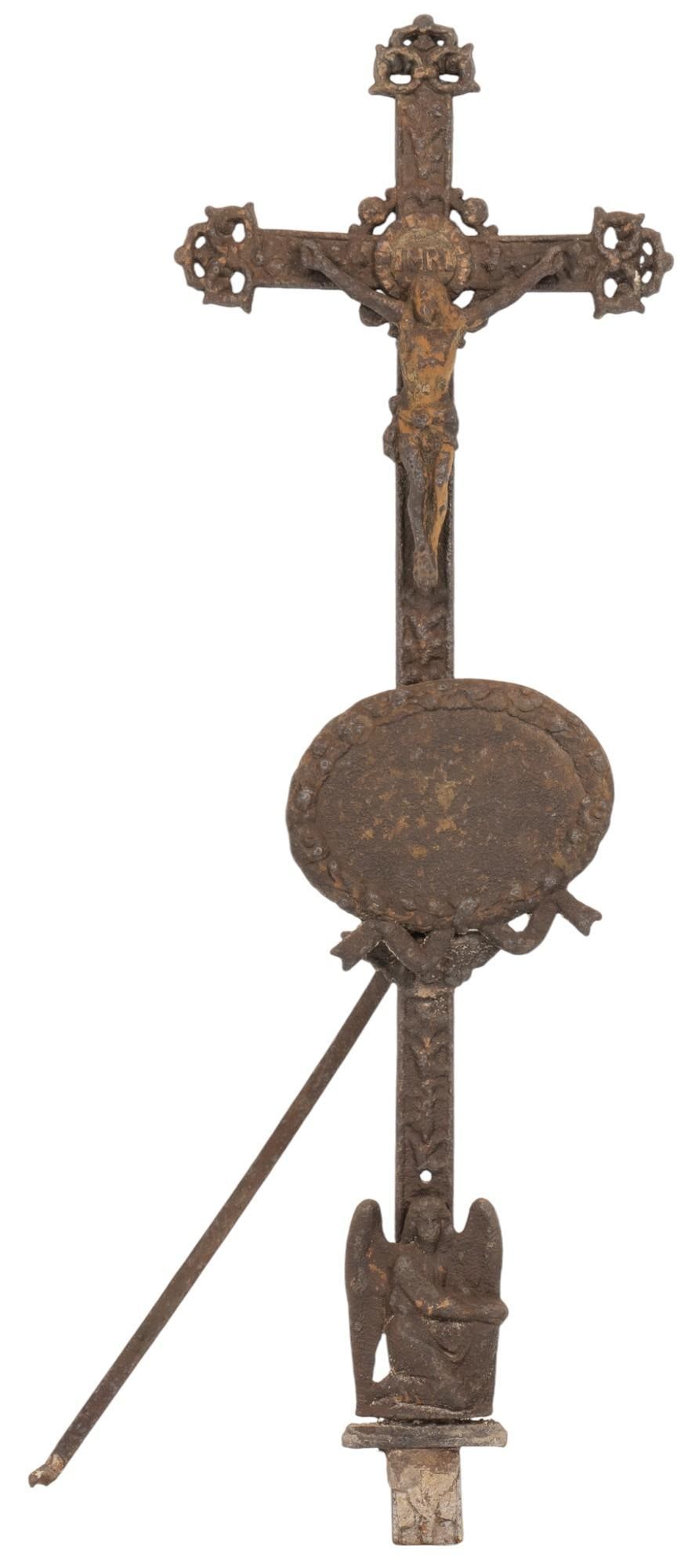 Iron Crucifix: Iron crucifix depicting Christ on the cross above an angel height 48.5 in. x width 16 in. x depth 8 in. Provenance: Property from the collection of a San Antonio, Texas gentleman