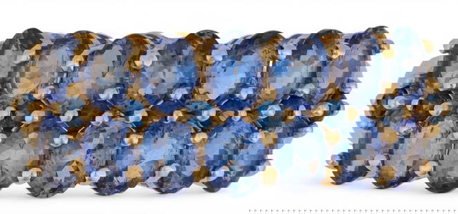14K Tanzanite Ring: 14K gold tanzanite ring featuring fourteen oval cut tanzanite stones, size 8, marked "14K Mexico" Total weight: 3.5 g