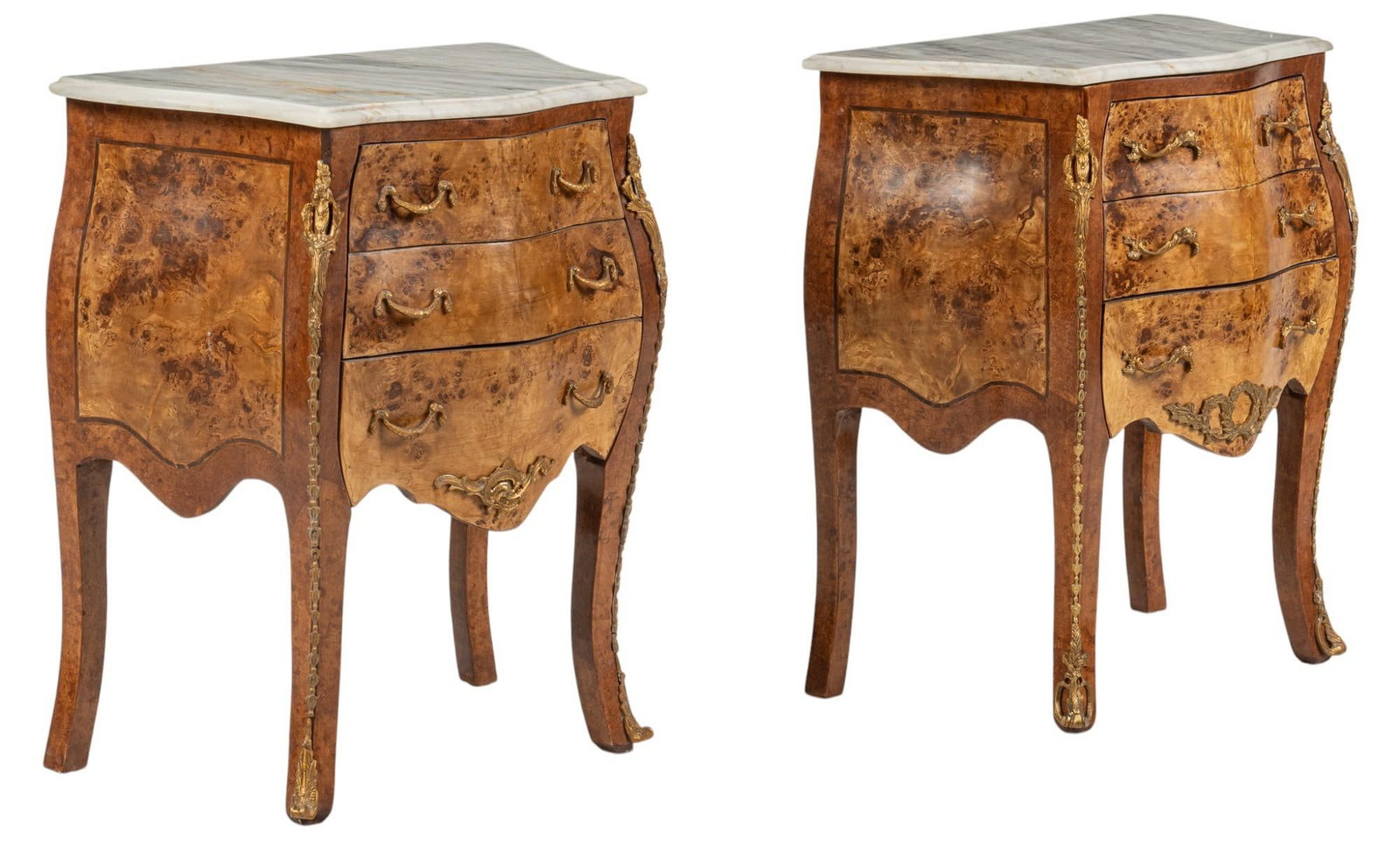Pair of Louis XVI Style Bombay Chests: Pair of Louis XVI style bombay chests with marble top, and gold-toned brass ormolu mountings, rising on saber legs height 30 in. x width 25 in. x depth 14.5 in.