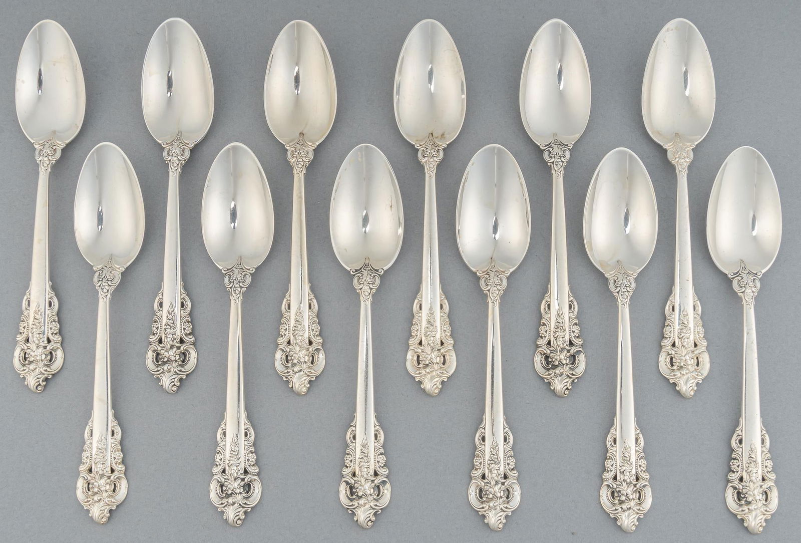 (12) "Grand Baroque" by Wallace Silversmiths Sterling Silver Teaspoons: Twelve "Grand Baroque" by Wallace Silversmiths sterling silver teaspoons, marked "Wallace Sterling" Total weight: 13.40 ozt