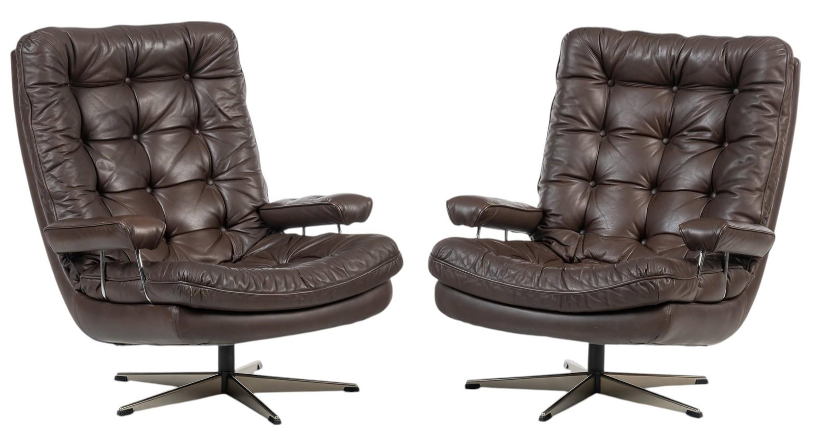 Pair of Danish Mid-Century Leather Lounge Chairs: Pair of Danish mid-century leather lounge chairs, tufted dark brown leather throughout, chrome details, padded armrests, on swivel base height 36 in. x width 30 in. x depth 34 in./ each