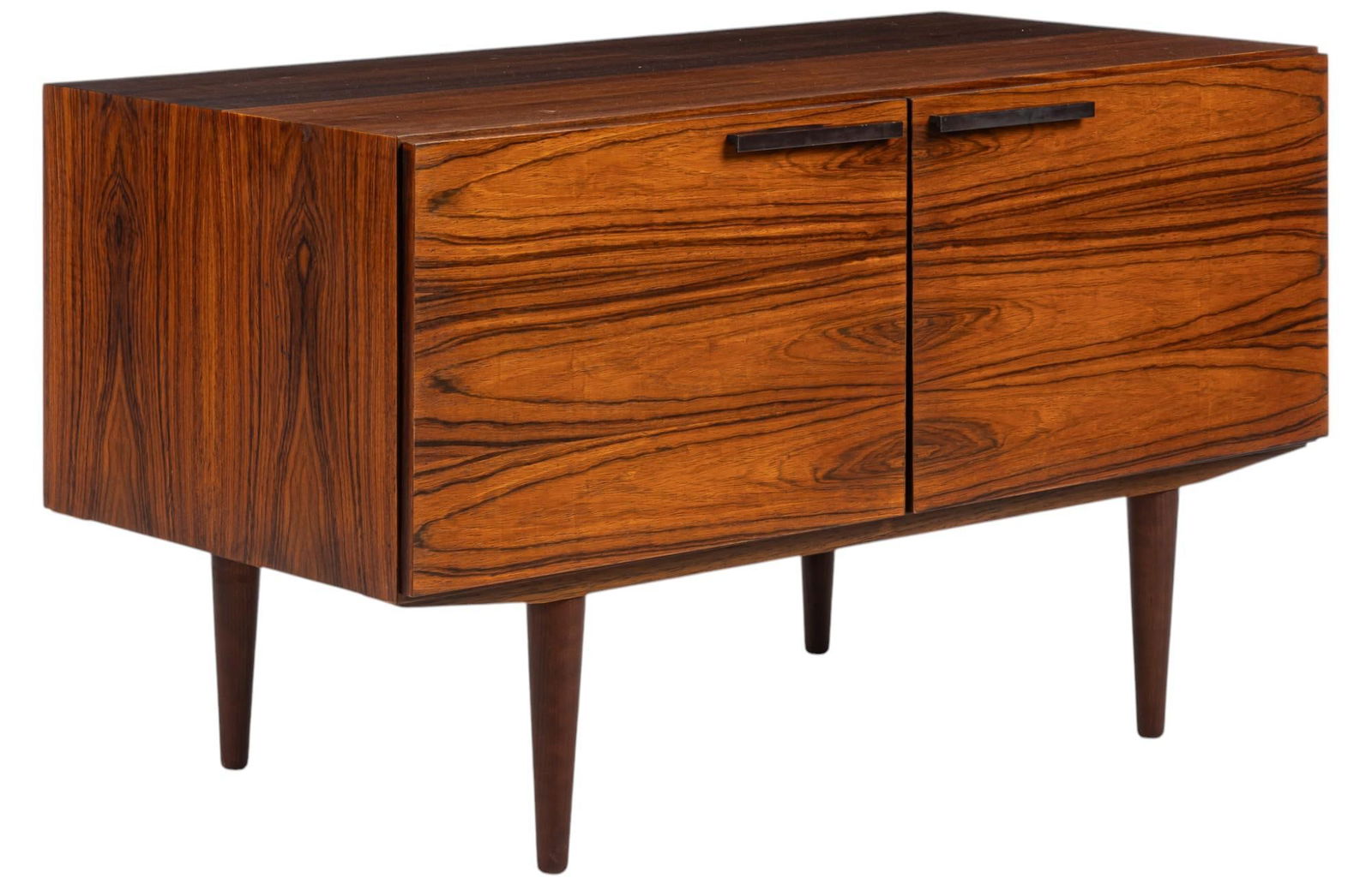 Small Danish Mid-Century Credenza: Small Danish mid-century credenza with pair of cabinet doors that open to divided interior storage with adjustable shelf on each side, supported on pin legs
