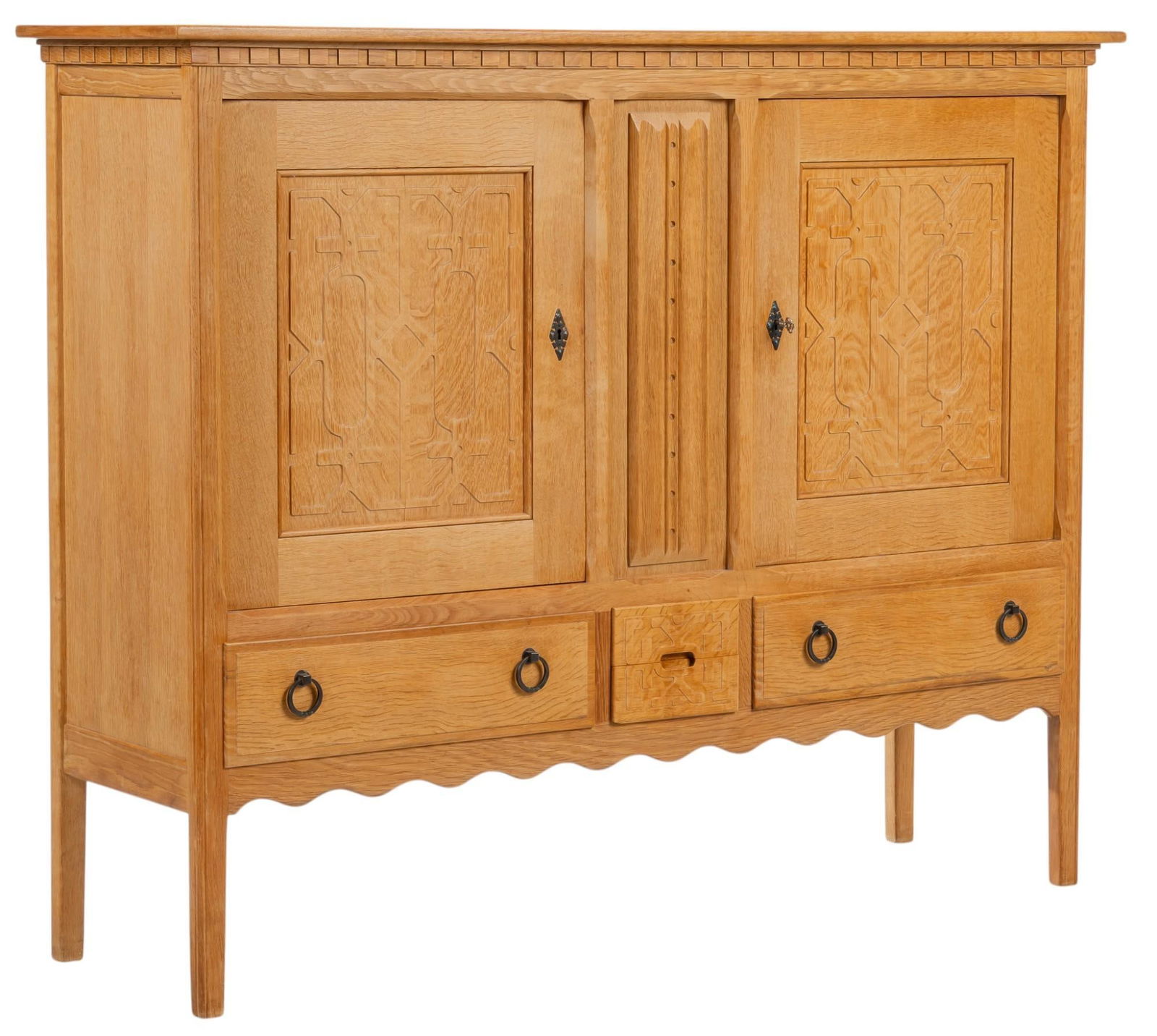 Henning Kjaernulf (DNK) Mid-Century Credenza: Henning Kjaernulf (Denmark) mid-century oak credenza with pair of cabinet doors that open to divided interior with two adjustable shelves on either side, small middle drawer, and two main drawers with