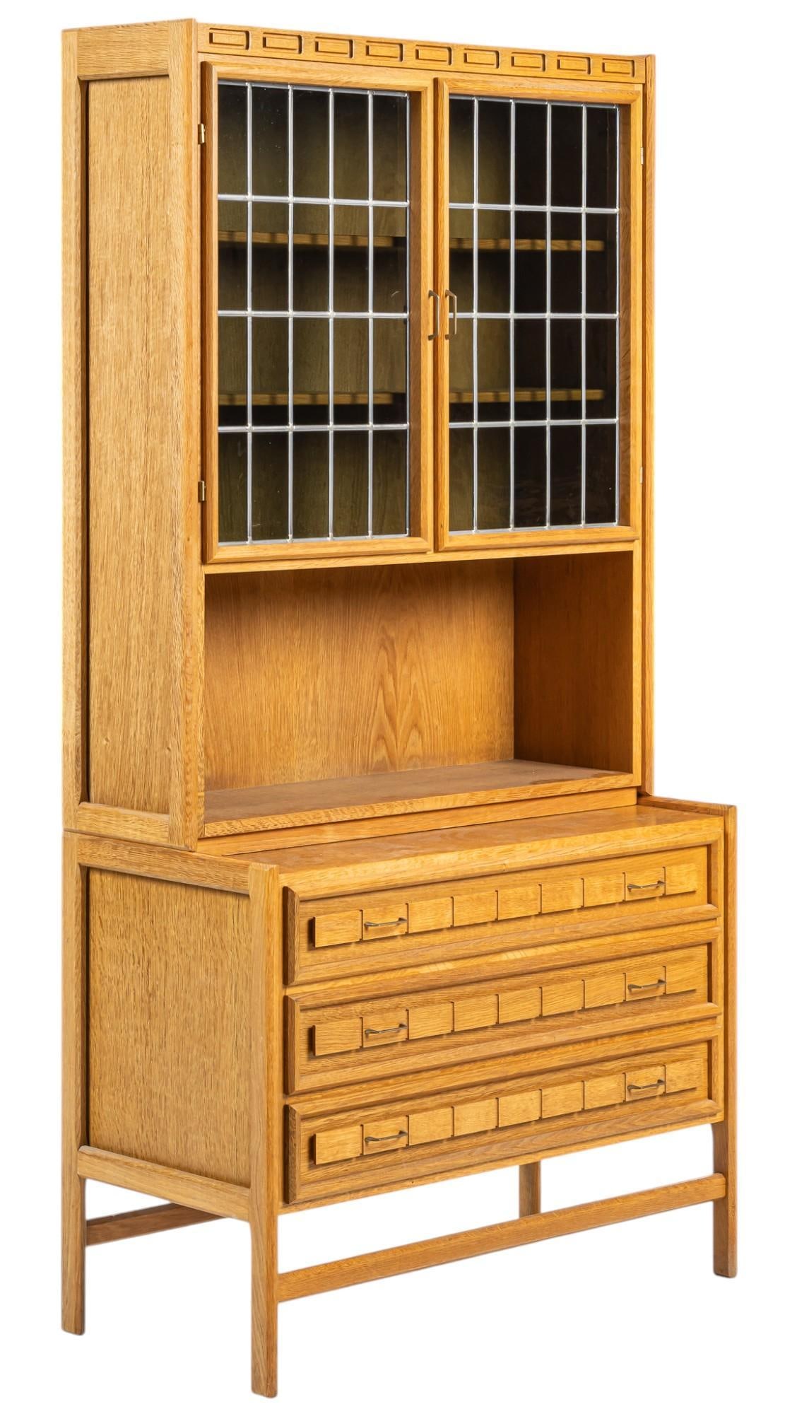 Henning Kjaernulf (DNK) Mid-Century Secretary Cabinet: Henning Kjaernulf (Denmark) secretary cabinet with pair of glass doors that open to interior with pair of shelves, supported on base with three drawers with metal pulls, on thin block legs height 72 i