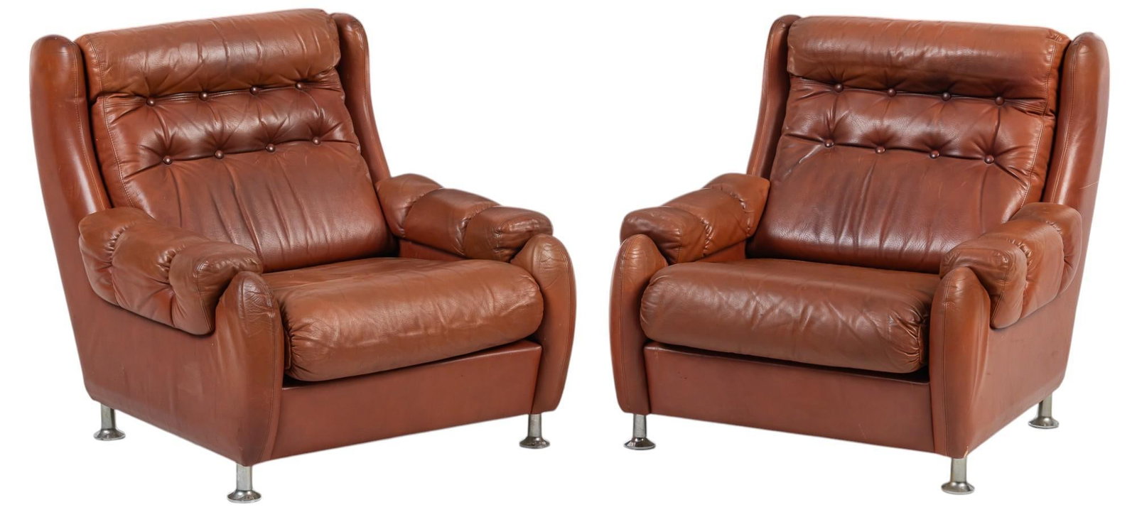 Pair of Danish Mid-Century Lounge Chairs: Pair of Danish mid-century leather lounge chairs with tufted red leather upholstery, and padded armrests, supported on metal legs height 32 in. x width 29 in. x depth 34 in.
