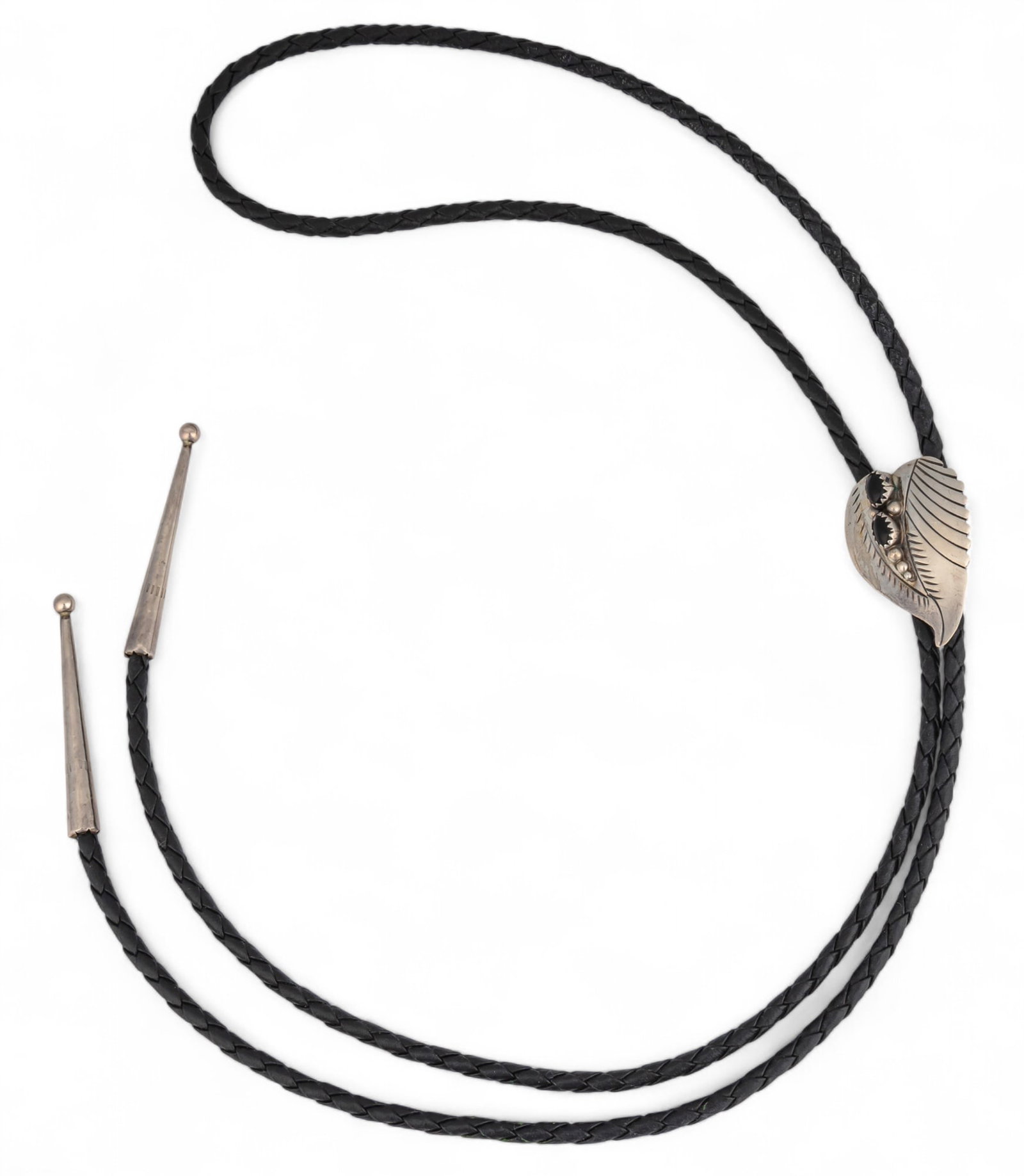 Sterling Bolo Tie: Black leather and sterling silver bolo tie, with black stone inlay Length 19 in. Total weight .54 ozt Provenance: Property from the collection of a prominent San Antonio, Texas busine