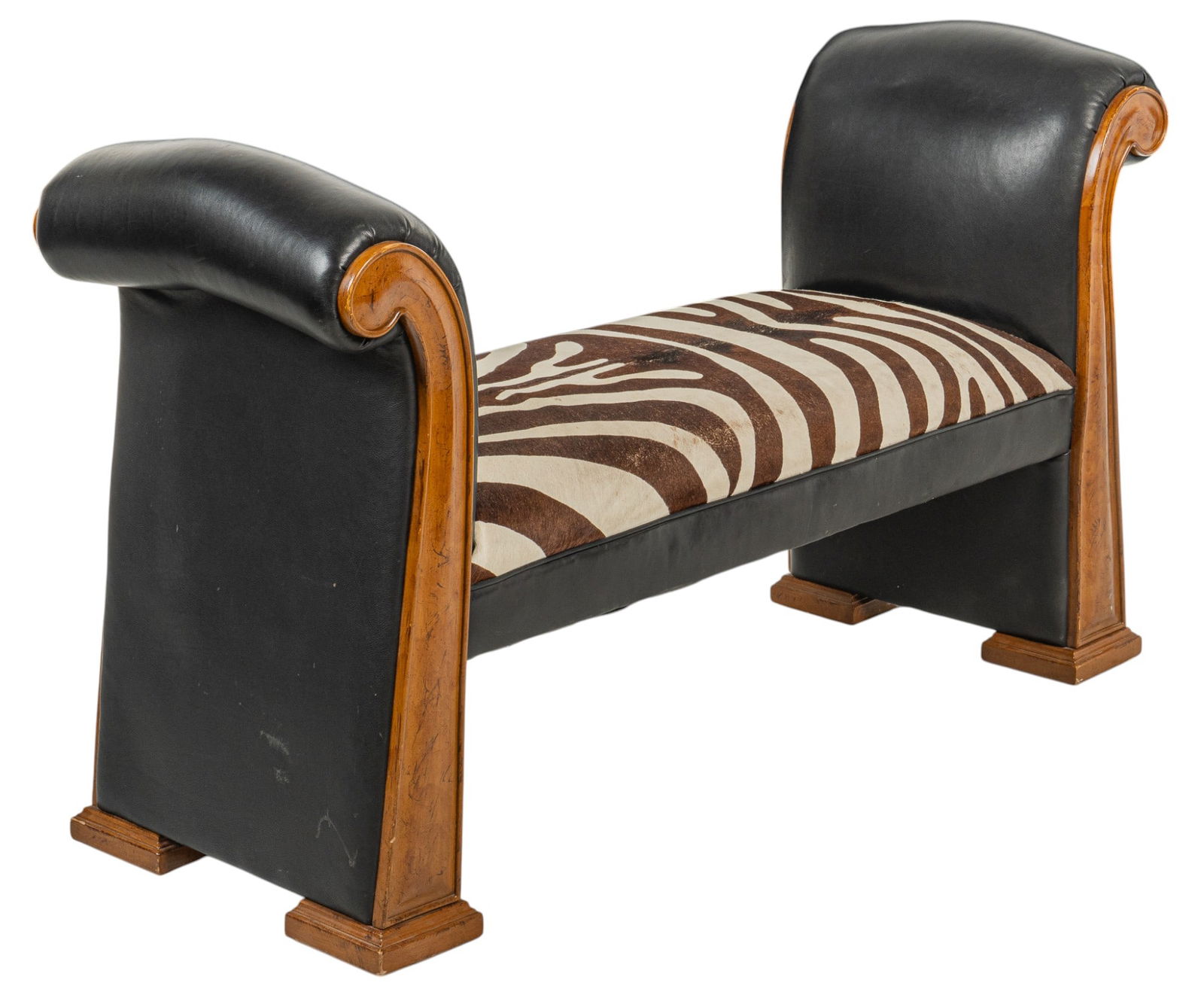 Zebra Hide Chaise: Chaise sofa with wooden frame, black leather, and zebra print hair on cow hide upholstery height 34 in. x width 57 in. x depth 21 in. Provenance: Property from a S