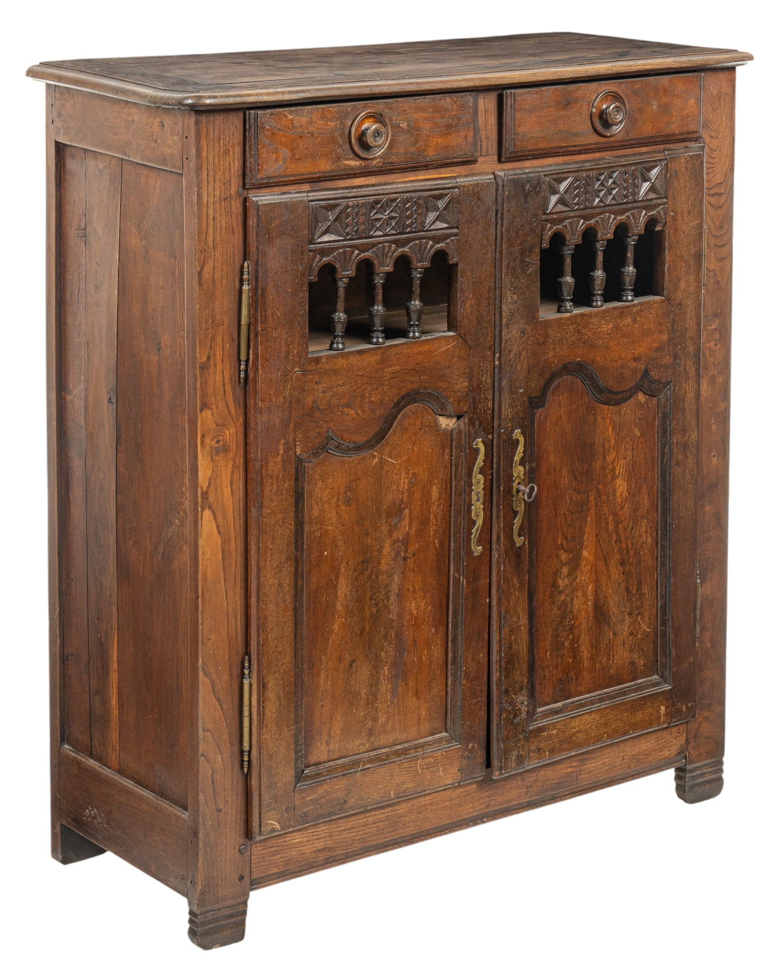 Carved Wood Two-Door Cabinet: Carved wooden cabinet with two drawers above two doors with decorative carvings and brass hardware, opens to two interior shelves height 47 in. x width 42 in. x depth 17 in. Provenance: Pro