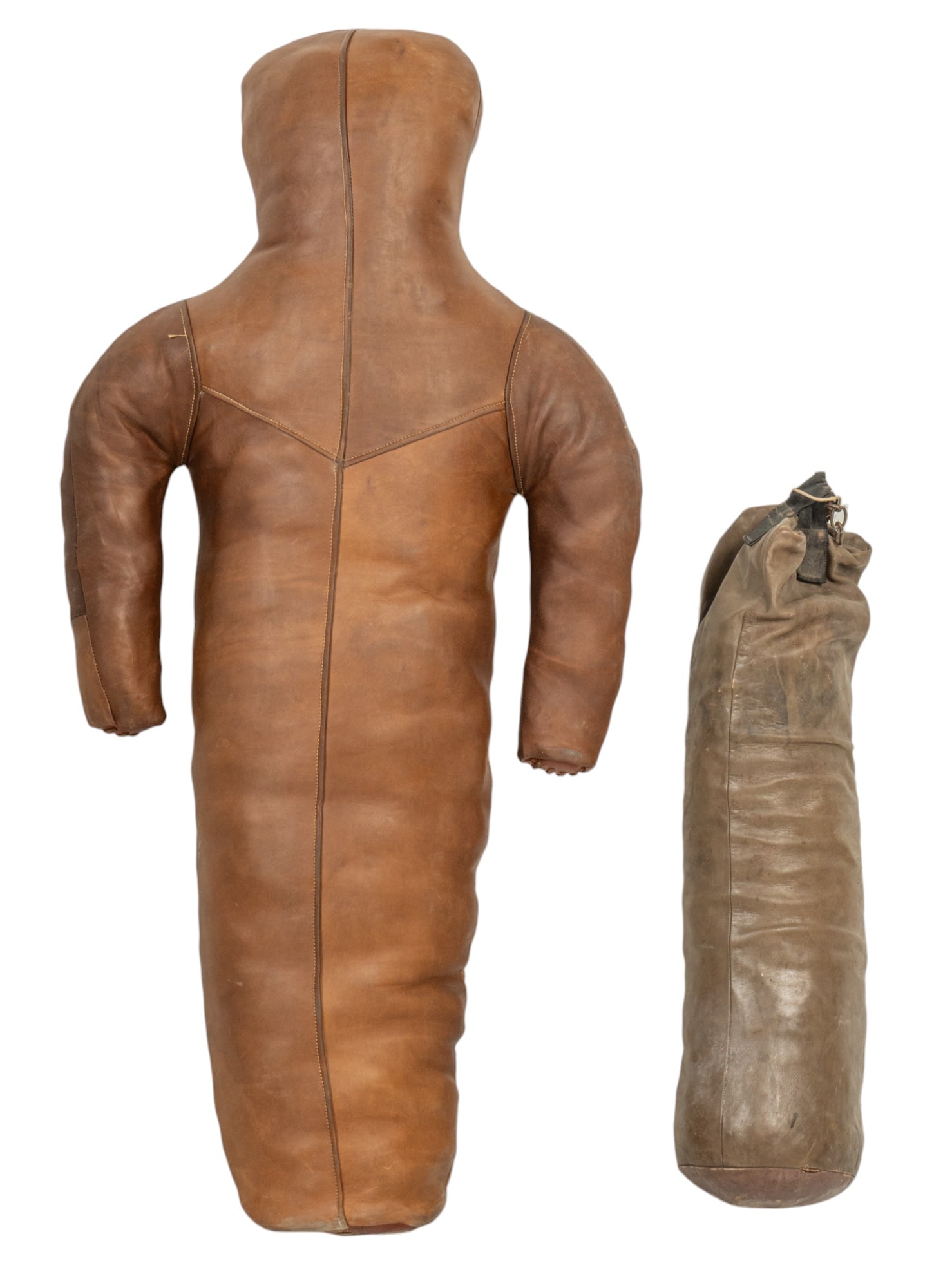 Vintage Leather Wrestling Dummy and Bag: Vintage leather wrestling or boxing dummy and bag, dummy is constructed of brown leather with stitched details, bag is a similar leather with a drawstring closure height 60 in. x width 30 in. x depth 