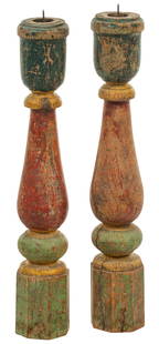 Pair of Painted Wood Candle Holders: Pair of turned wood candle holders with original paint, a bulbous form with a cylindrical base and top height 27 in. x diameter 4 in. Provenance: Property from the family of late noted Texas arch