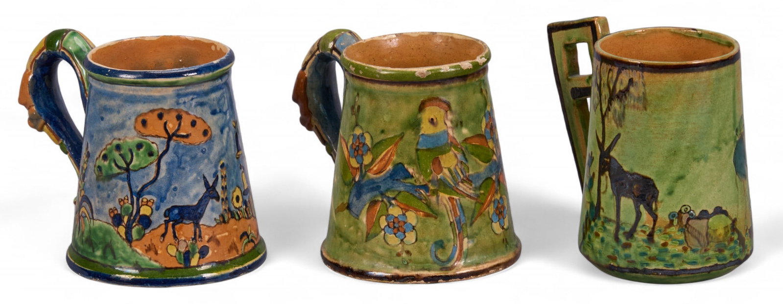 Set of (3) Tonala Pottery Mugs: Set of three hand-painted Tonala (Jalisco) pottery mugs, with blue and green glazing, one with geometric handle, circa 20th century height 4 in. x diameter 6 in. / tallest