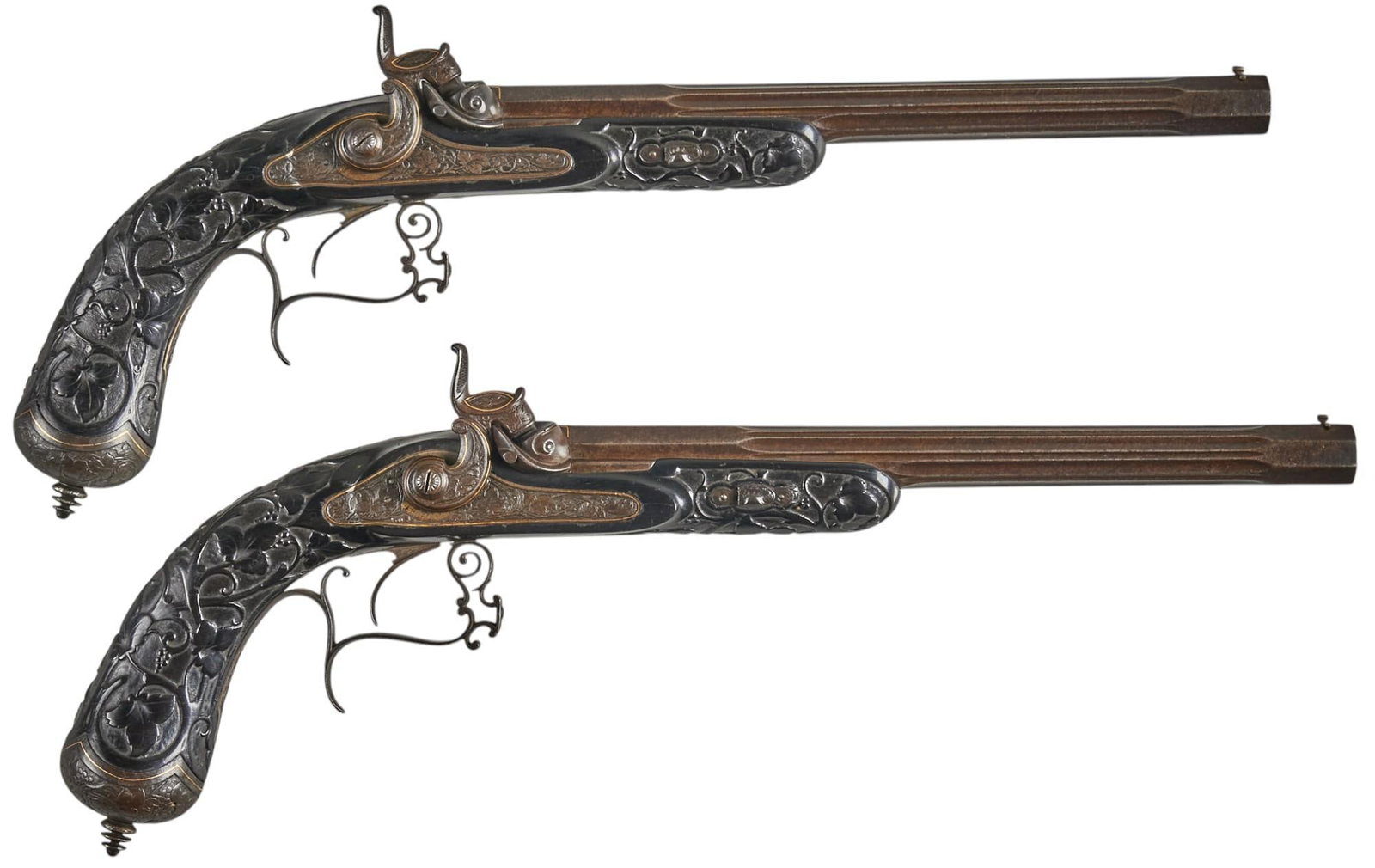 Beautiful Dutch Carved Ebony Dueling Percussion Pistols W/ Gold Overlay: Manufacturer: P. Stevens te Maastricht-Denmark Model: Percussion Dueling Pistols Caliber: approx. 48 cal. ball Barrel length: 10 in. OAL: 17 in. Condition: Good-Antique; ebony carved wood stocks have