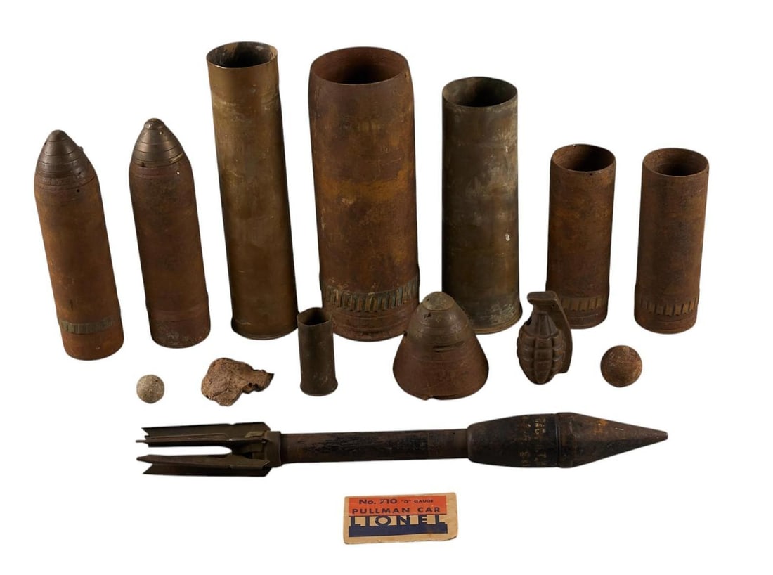 Collection of 13 Mixed Inert Military Ordnance: Collection of 13 Mixed Inert Military Ordnance Includes: -WWII Dummy Anti-tank Bazooka rocket -WWI era 40mm casing marked: "37-85" / "PDPs 143.1.17" w/ flaming bomb -2 pcs: concrete ba