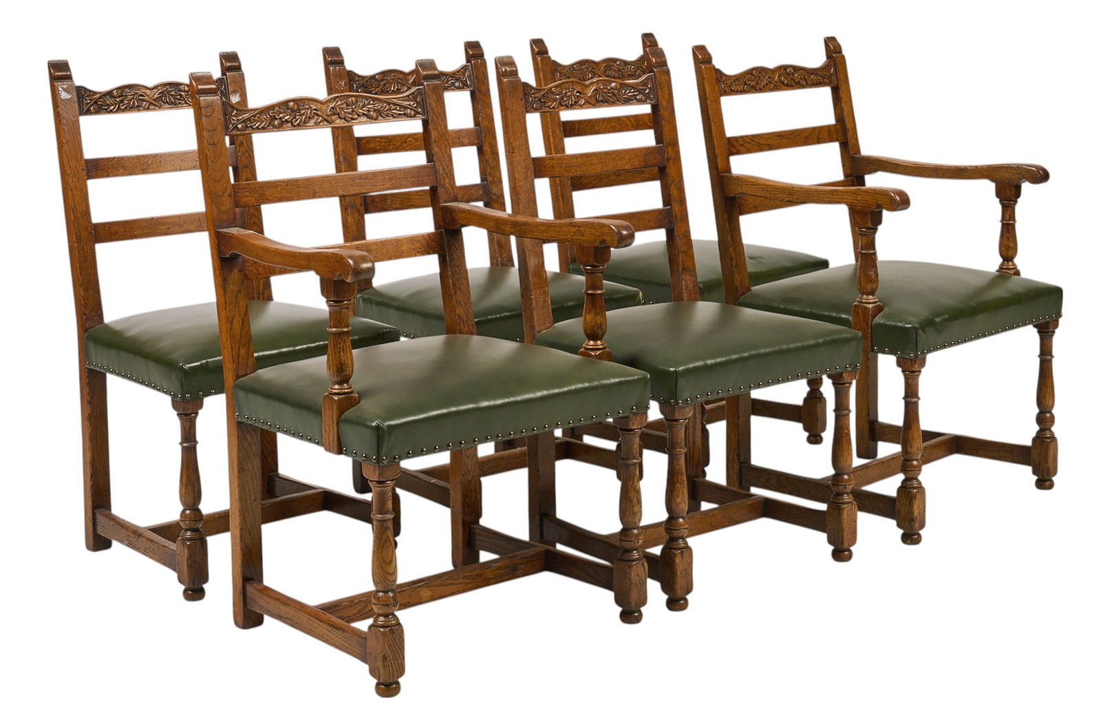 (6) Black Forest Carved Ladder Back Chairs: Set of six wooden ladder back chairs with carved Black Forest motifs, and green leather seats with rivet trim, supported on turned legs height 38 in. x width 23 in. x depth 22 in. / each