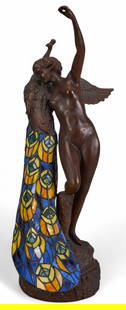 Art Nouveau Style Stained Glass and Bronze Lamp: Art Nouveau style lamp with&nbsp;bronze figure of a woman, holding a peacock with a stained glass tail, in working condition height 26 in. x width 10.5 in. x depth 13 in. Provenance: Property from a h