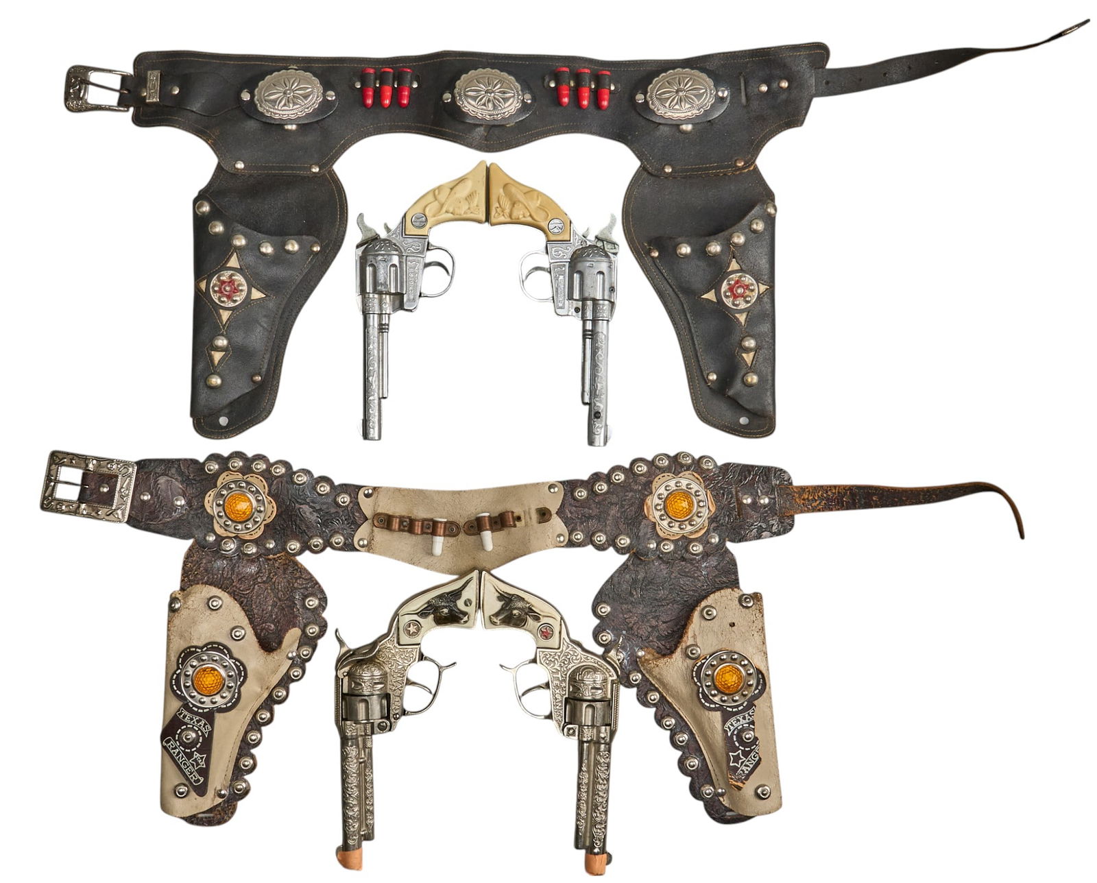 (2) Pairs of Western Cap Gun Toys W/ Belts and Holsters mmm: Includes: -pair of Hubley Texan cap gun revolvers w/ belt and holsters; embossed leather w/ studding; dummy rounds included on belt -pair of Kilgore Ranger cap gun revolvers w/ belt & holsters; du