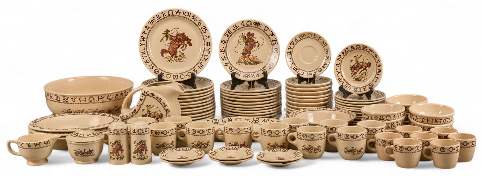 (95) Westward Ho Rodeo Pattern By Wallace China Dinnerware Set, Till Goodan Designs: Large collection of china dinnerware from Wallace China's "Westward Ho Rodeo" pattern, Till Goodan designs, to include plates, tea cups, serving bowls, sugar and creamer s