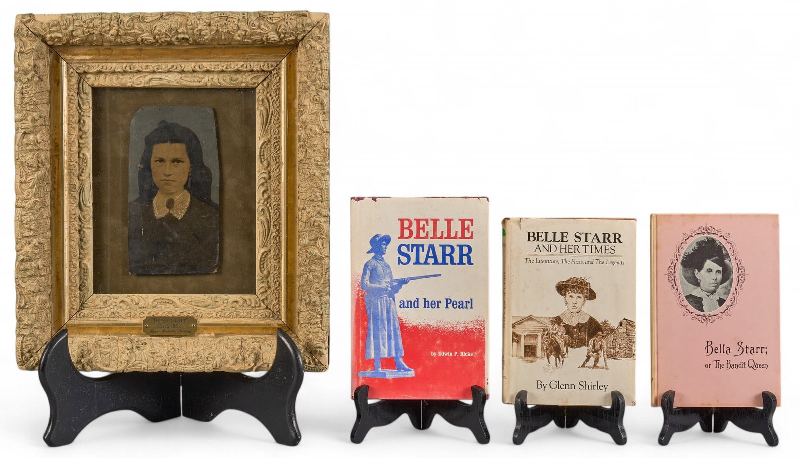 Belle Starr Tintype ca. 1862: Tintype photograph of Belle Starr from the Starr estate, ca. 1862, with hand coloring; lot includes books about Belle Starr, including author-signed copy of "Belle Starr and Her Peals"