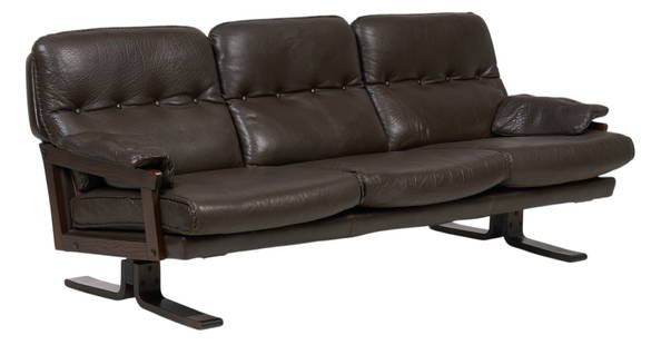 Danish Mid-Century Leather Sofa: Danish mid-century sofa with dark brown leather upholstery with thick-stitch trim, supported on wooden frame with trestle legs&nbsp; height 30.5 in. x width 76 in. x depth 31 in.&nbsp; Provenance: Imp