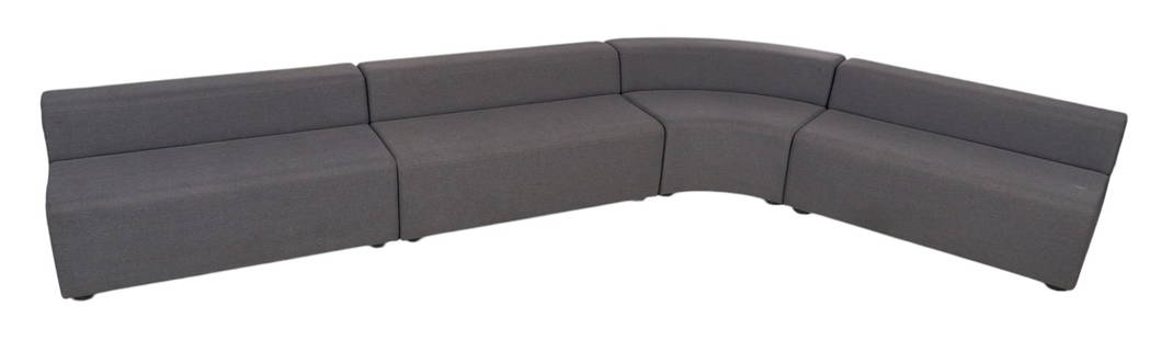 Knoll (USA), Gray Modular Sofa: Four-piece Knoll (USA) modular sofa, composed of three low back two-seat benches, and one low back curved bench, in gray upholstery, marked by manufacturer label height 26.5 in. x width&nbsp;52 in. x