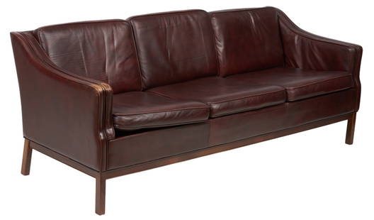 Danish Mid-Century Brown Leather Sofa: Danish mid-century sofa with brown&nbsp;leather upholstery, supported on wooden block legs height 31 in. x width 77 in. x depth 32 in. Provenance: Imported directly from Denmark to Vogt Auction, curat