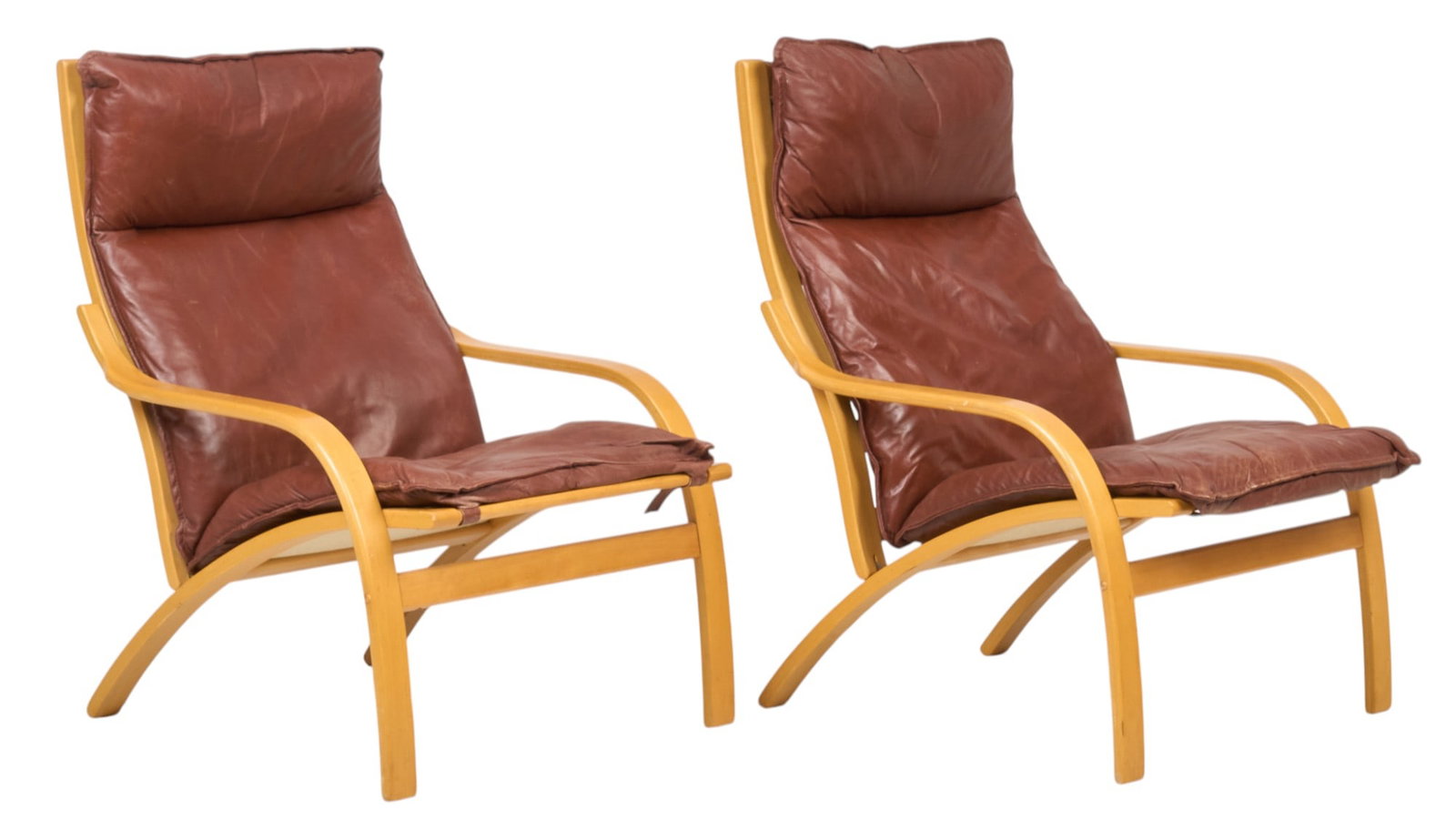 Pair of Danish Mid-Century Lounge Chairs: Pair of Danish mid-century lounge chairs with bentwood frames, and maroon leather cushion seats height 38 in. x width 26.5 in. x depth 30 in. / each Provenance: Imported directly from Denmark to