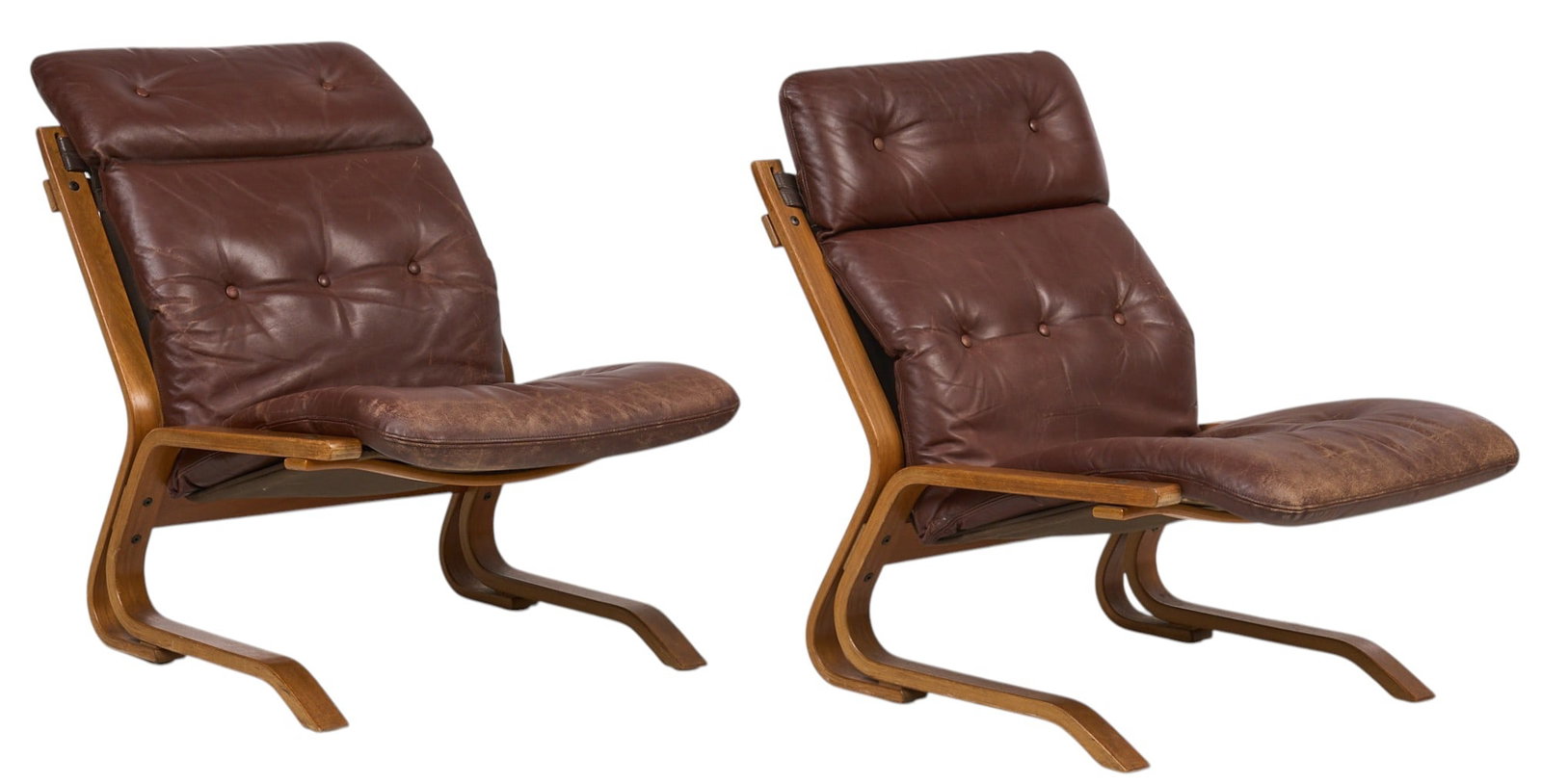 Pair of Mid-Century Bentwood Chairs: Pair of Danish mid-century betwood chairs with tufted leather cushions height 33 in. x width 25 in. x depth 35 in. / each Provenance: Imported directly from Denmark to Vogt Auction, curated from Danis