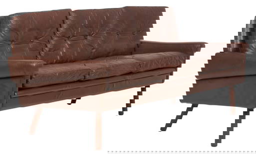 Danish Mid-Century Leather Sofa: Danish mid-century brown leather sofa with tufted cushions, supported on splayed pin legs height 30 in. x width 72 in. x depth 31 in. Provenance: Imported directly from Denmark to Vogt Auction, curate