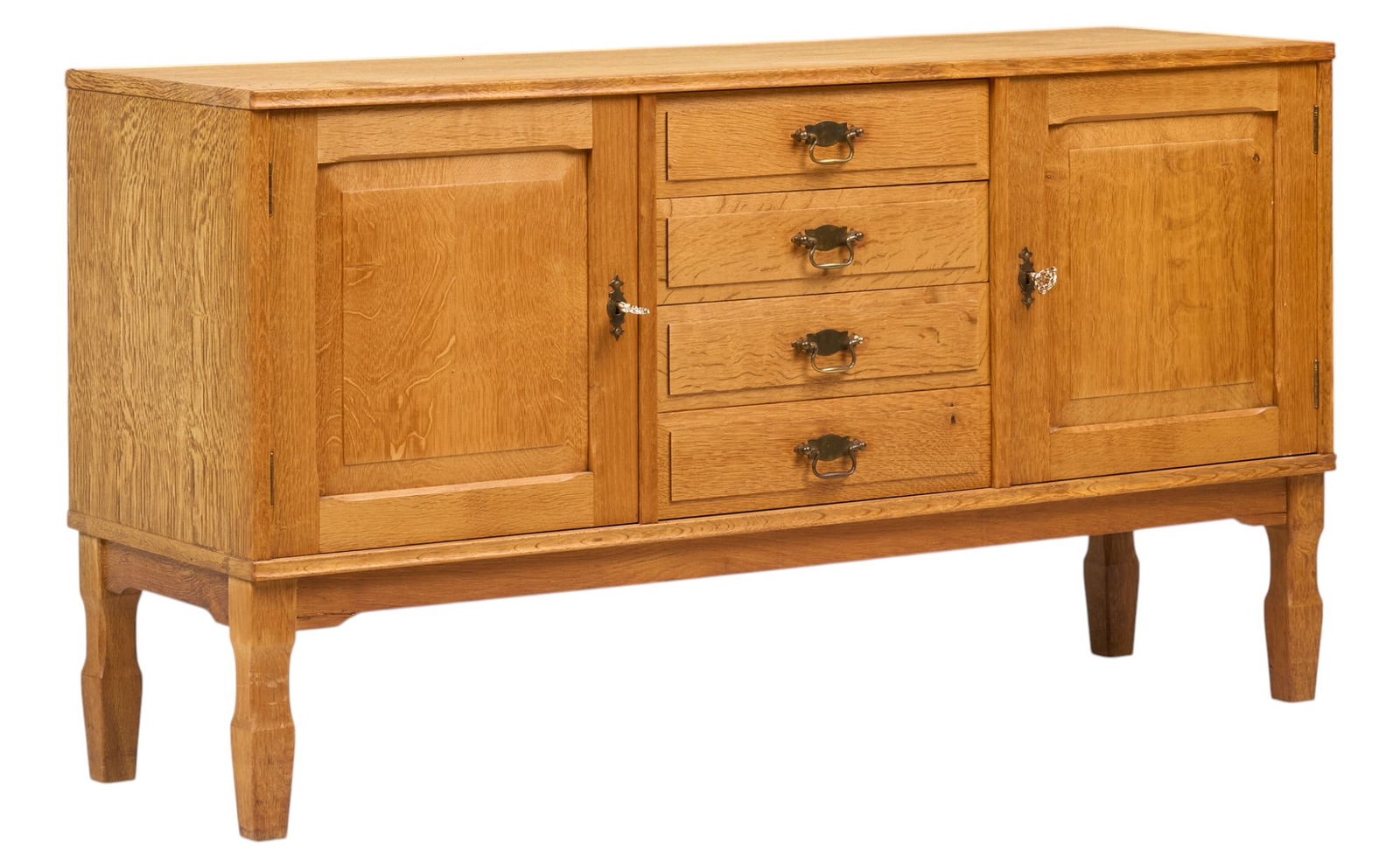 Henning Kjaernulf (DNK) Credenza: Henning Kjaernulf (Denmark) oak mid-century credenza with central stack of four drawers, and two cabinet doors that open to interior each with single adjustable shelf height 29.5 in. x width 53.5 in.