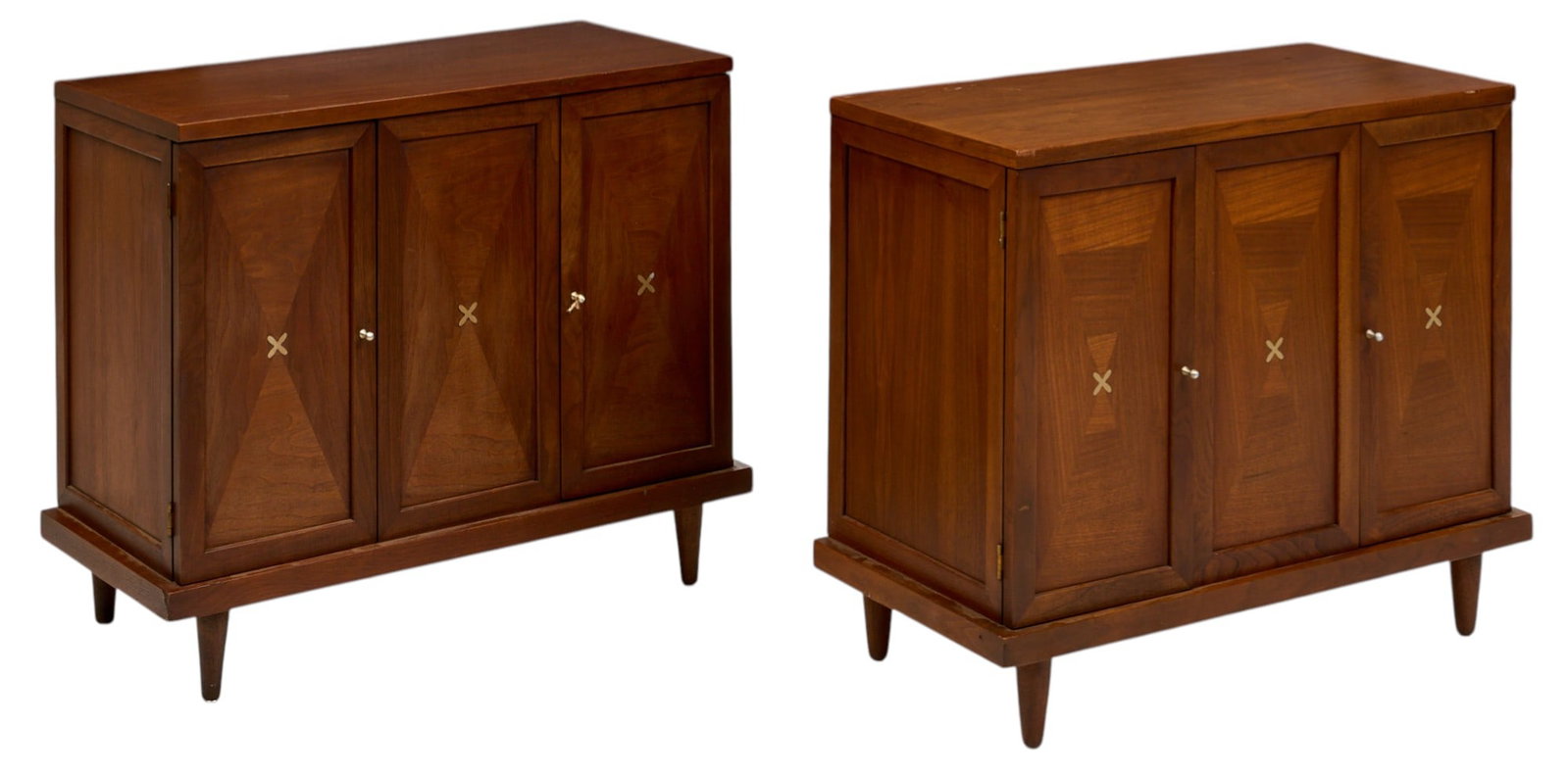 (2) Merton Gershun for American of Martinsville Cabinets: Pair of Merton Gershun for American of Martinsville cabinets, each with two cabinet doors with metal pulls, opening to single-shelved interior, inlaid metal details to front panels, on pin legs height