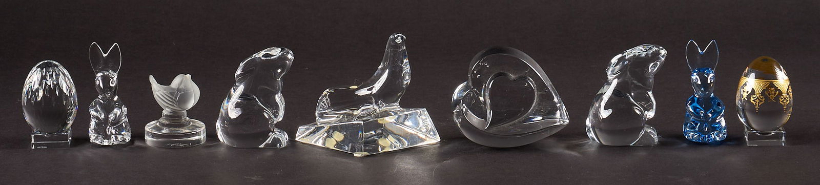 Collection of Baccarat, Steuben, Lalique Crystal Animal Figurines: Collection of nine crystal figurines, with most marked Baccarat, also with Steuben and Lalique, includes rabbits, sea lion, birds, eggs, heart height 4 in. x width 4.5 in. x depth 4.5 i