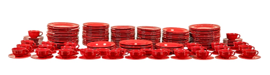 Large Collection of Red Ceramic Dinnerware: Large collection of glazed red ceramic dinnerware, with plates, bowls, cups, and saucers height 1.5 x width 10 in. / largest Provenance: Property from a home in San Antonio, Texas