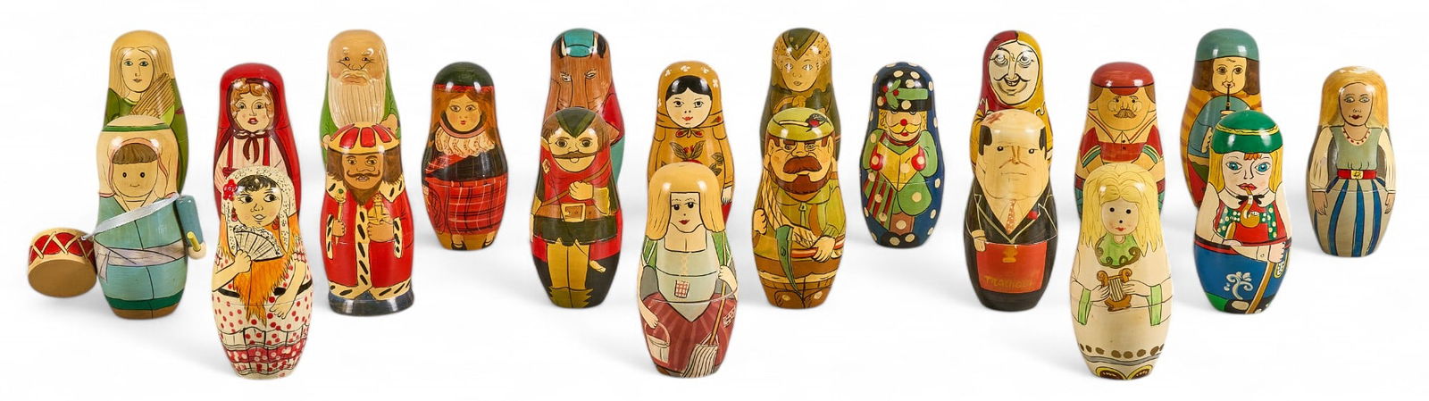(21) Hand-Painted Russian Matryoshka Nesting Dolls: Set of twenty-one Russian Matroyshka nesting dolls, each hand-painted with traditional folk motifs and storybook characters height 5.5 in. x width 4 in. x depth 4 in. / largest Provenance: P