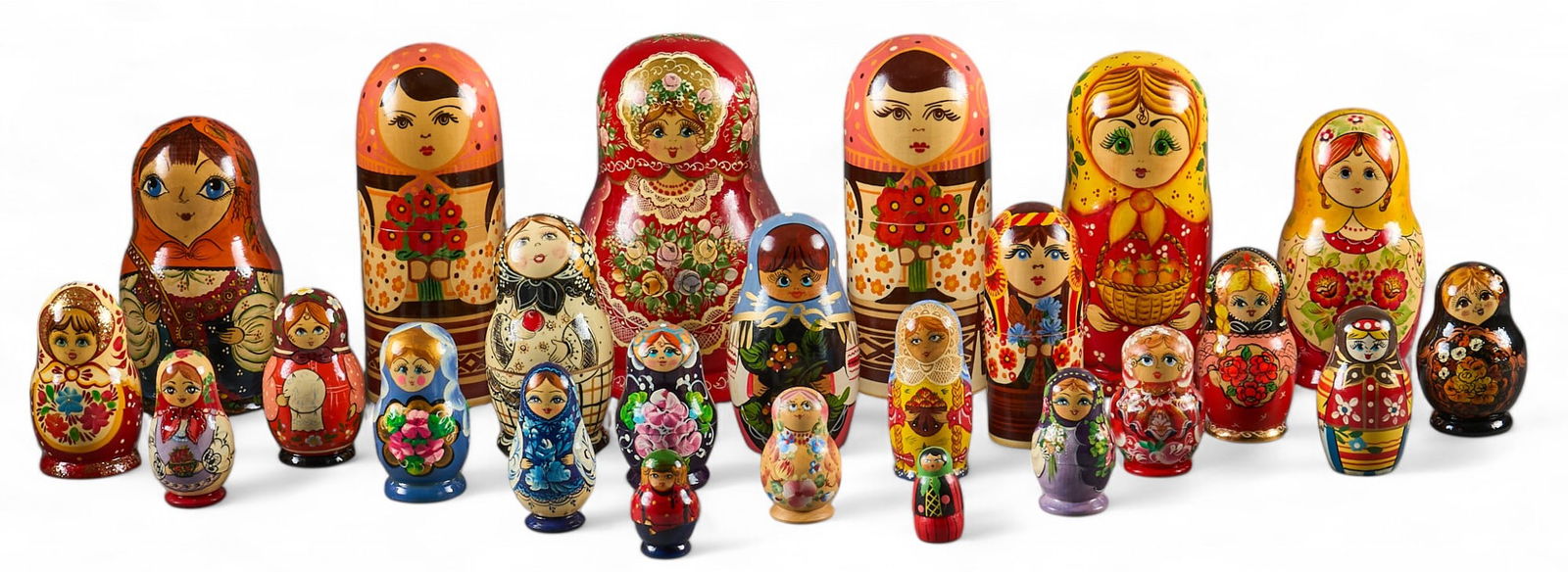 (34) Russian Matryoshka Nesting Dolls: Collection of thirty-four Russian Matryoshka nesting dolls, each hand-painted with traditional designs, of varying sizes height 8.5 in. x diameter 5 in / largest Provenance: Property from th