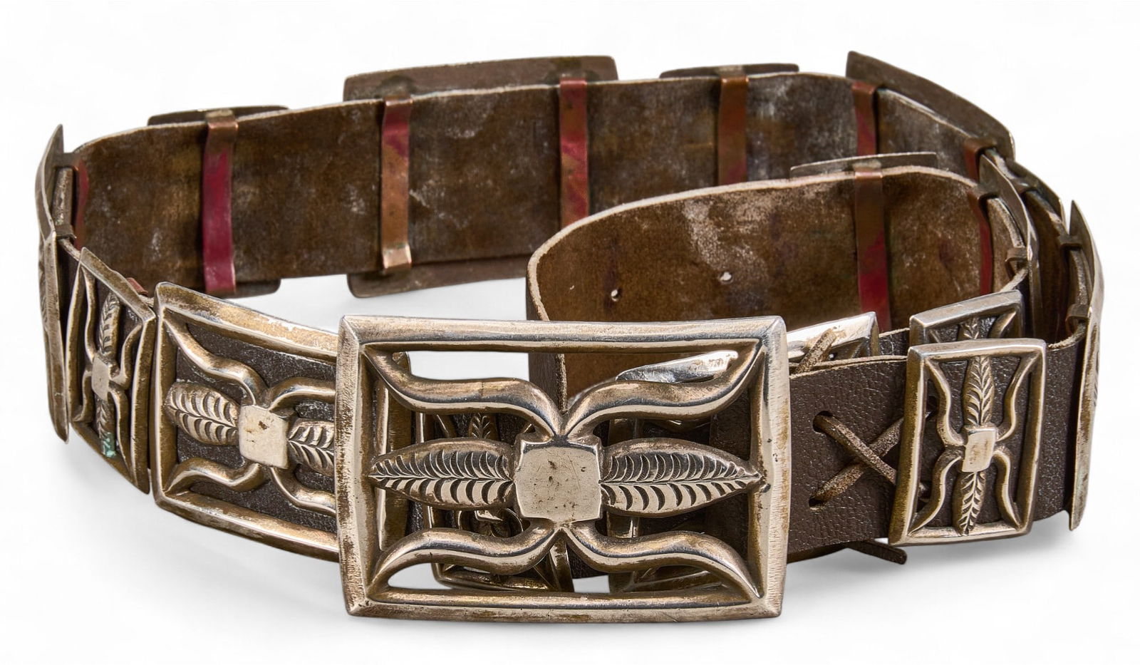 Sterling SIlver Concho Belt: Sterling silver concho belt with aged leather belt with patina length 33 in. total weight: 13.96 ozt Provenance: Property from a home in San Antonio, Texas 