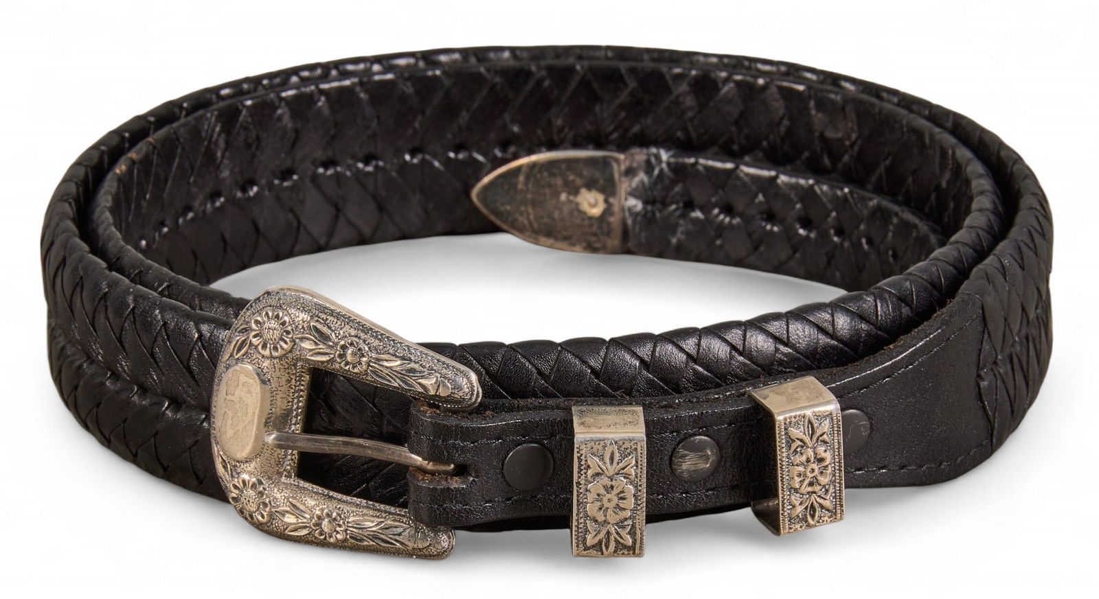 Black Woven Leather Belt with Sterling Silver Buckle, Size 40: Black woven leather belt featuring a sterling silver buckle and decorative silver accents, size 40 Provenance: Property from the collection of a prominent San Antonio, Texas businessman