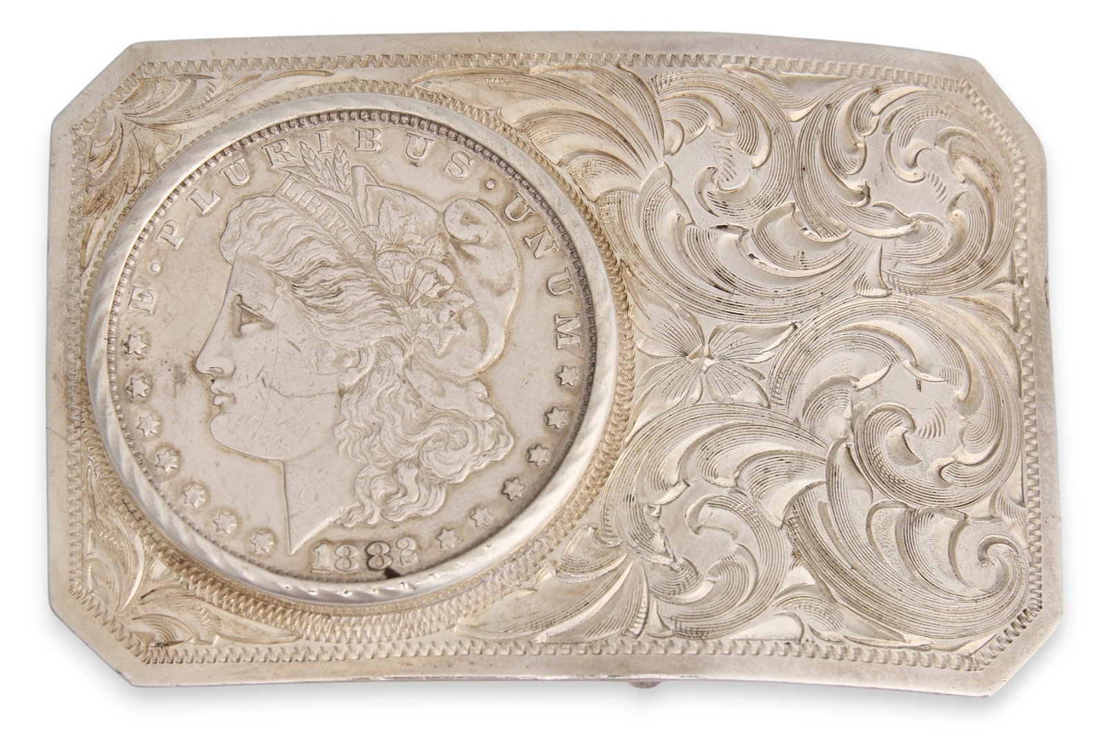 1882-S Morgan Silver Dollar Belt Buckle: United States 1882 Morgan silver dollar coin and chased silver belt buckle, marked "Prairie Silver" height 2 in. x width 2 3/4 in. Total weight: 75.780g